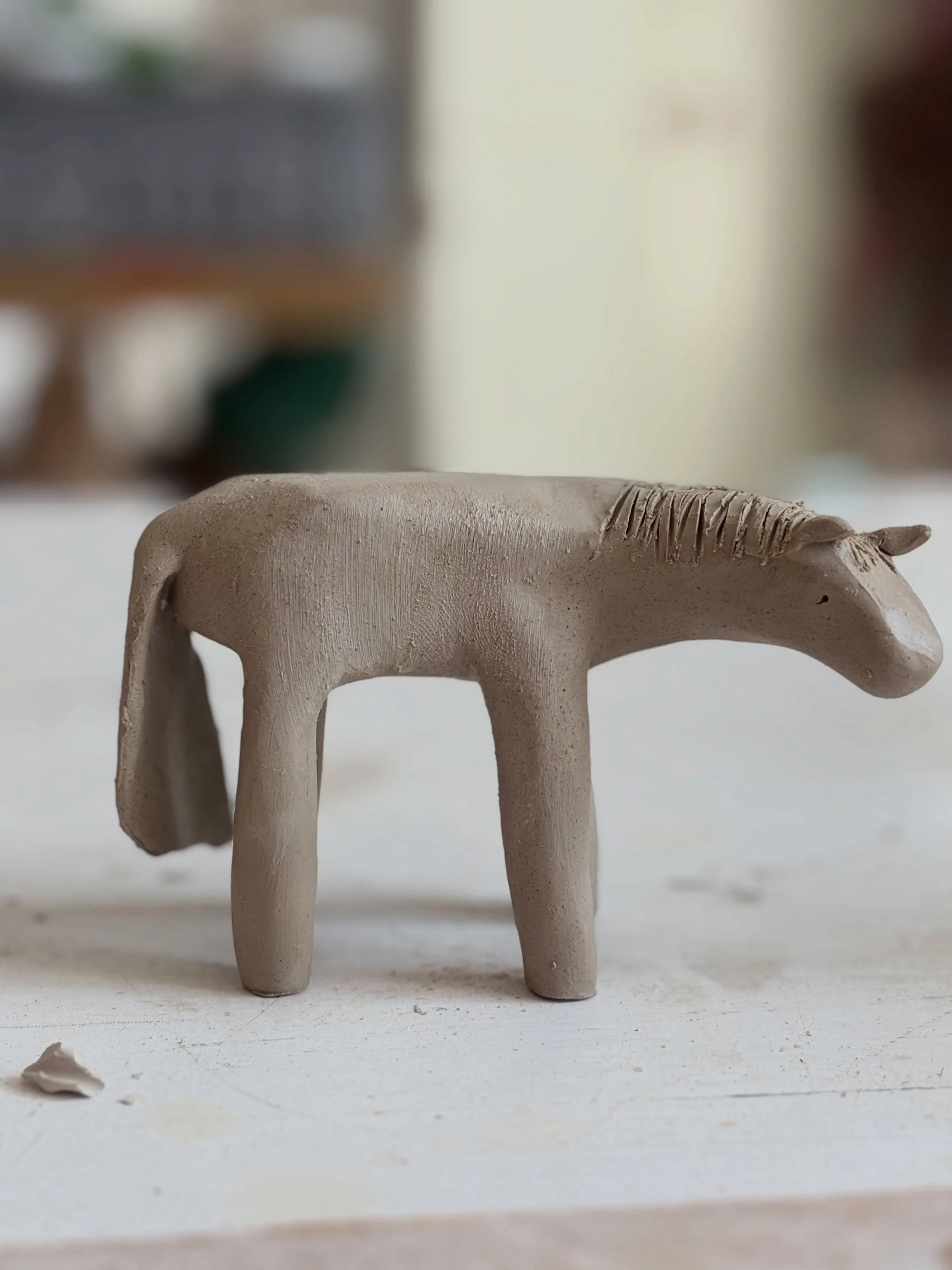 I made some horses today. They are now drying in the sunshine. 

Horses are herd animals and like to graze together. Even though these are made of clay I always put them in herds to dry and *whispers** fire them.