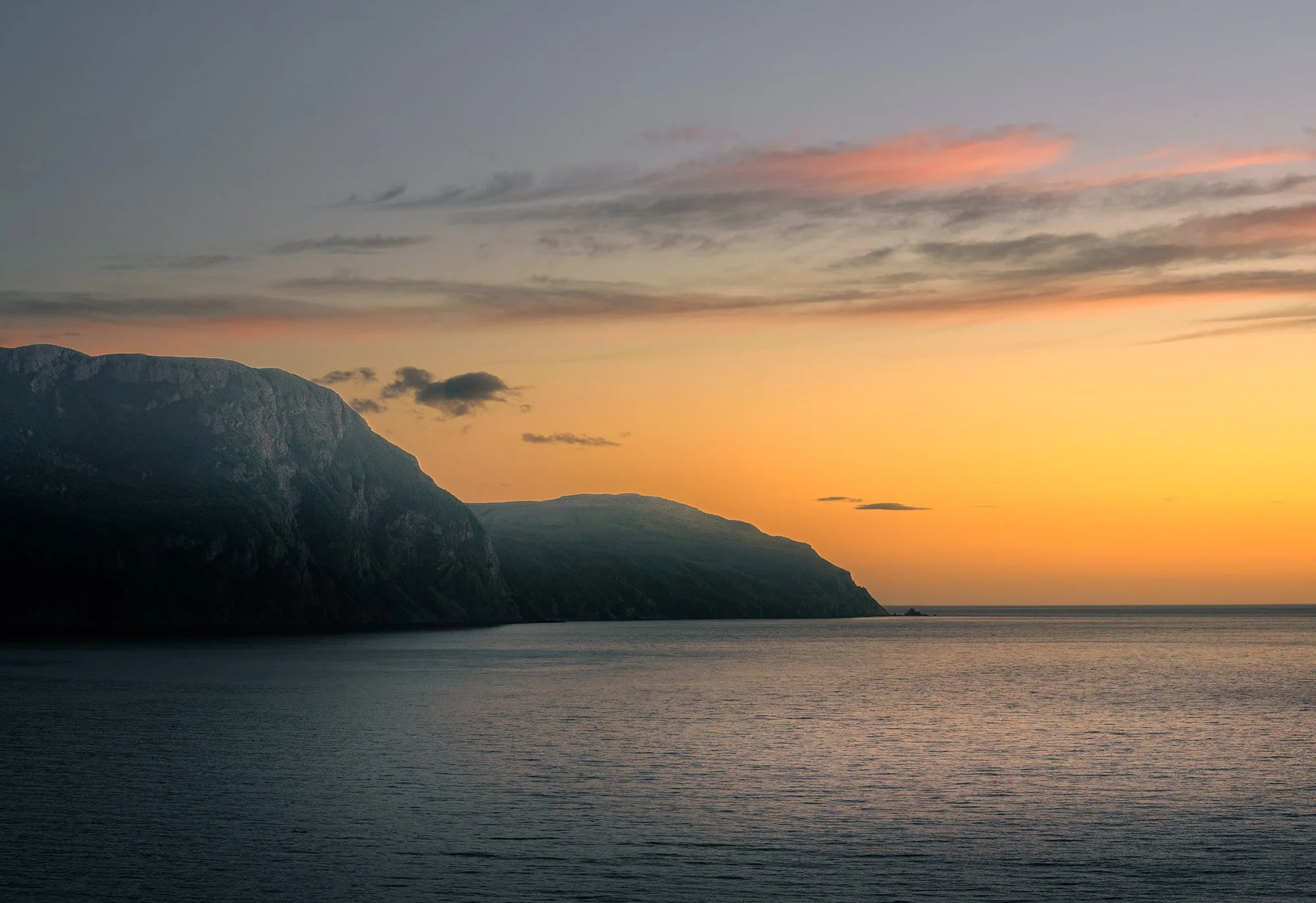 Rocky harbour sunset ocean 2.jpg