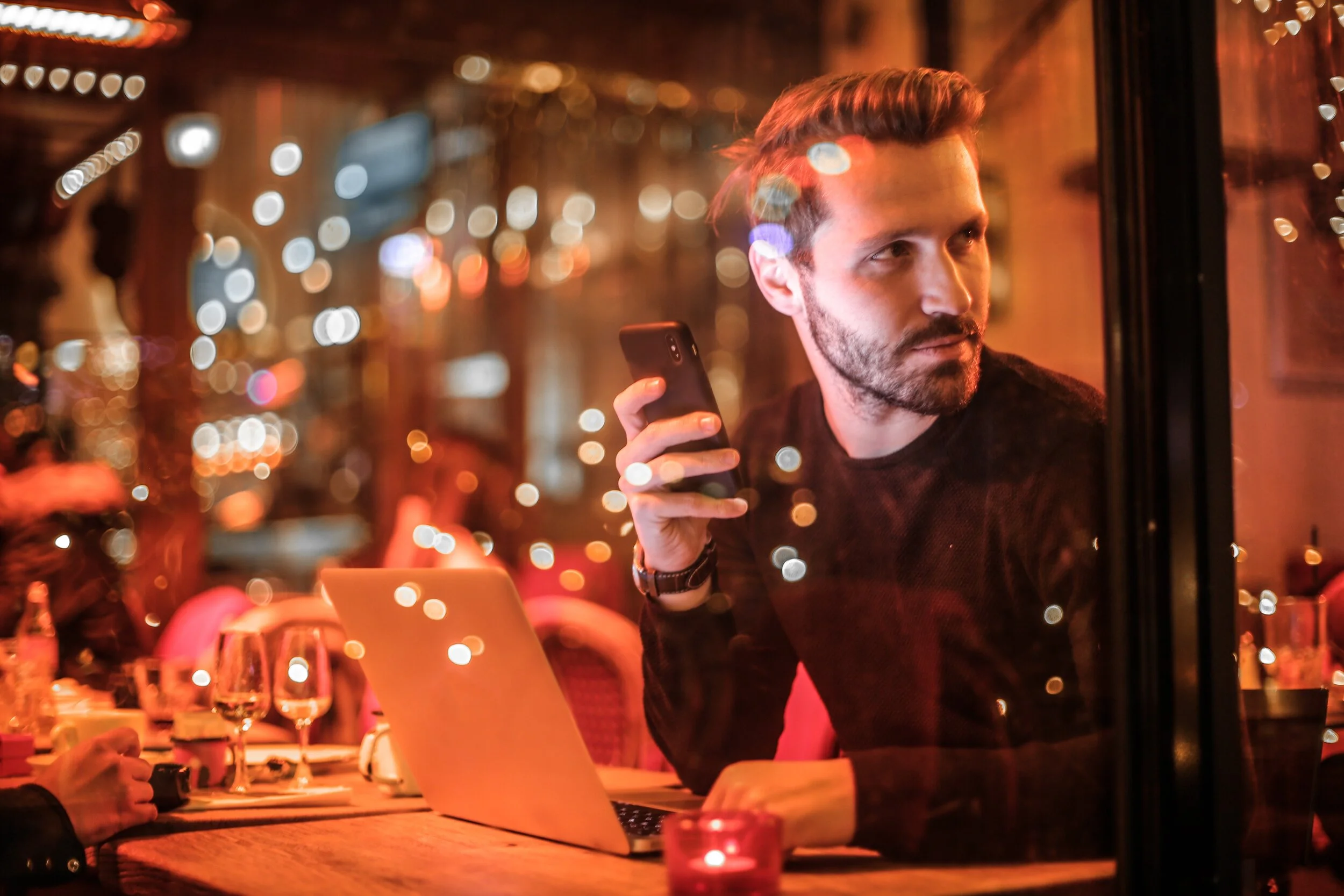 man-holding-black-smartphone-1437554.jpg