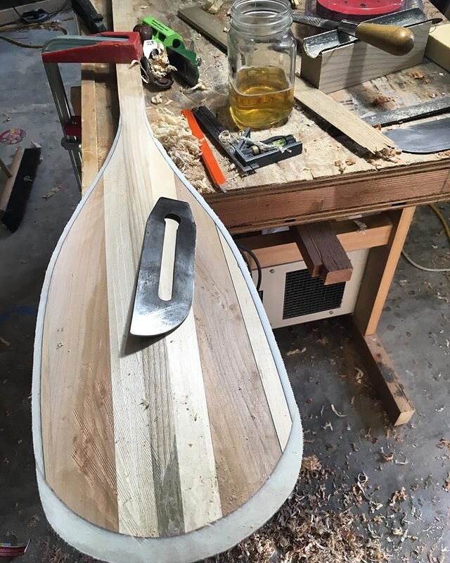 A little paddle carving and a little Eastern Divide Pilsner from @risingsilobrewery down the road round out a great Sunday #handtools #whitewaterismagic #kayakpaddlesallmonth