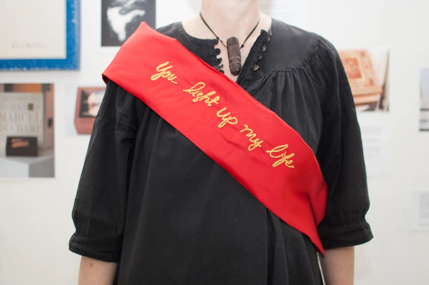 You light up my life, Award Sash: vintage satin, embroidery thread, 8 x 48”, 2013 (Photograph: Ashley Wood)
