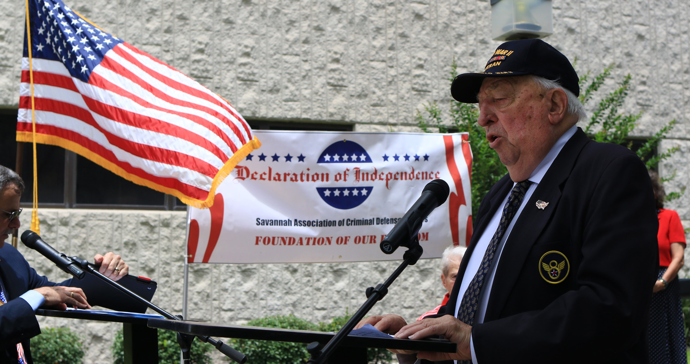  World War II veteran Paul Grassey, who flew B-24 bombers for the Mighty Eighth Air Force, sings "God Bless America" in July 2016 in front of the Chatham County Courthouse after local community leaders and elected officials read the Declaration of In