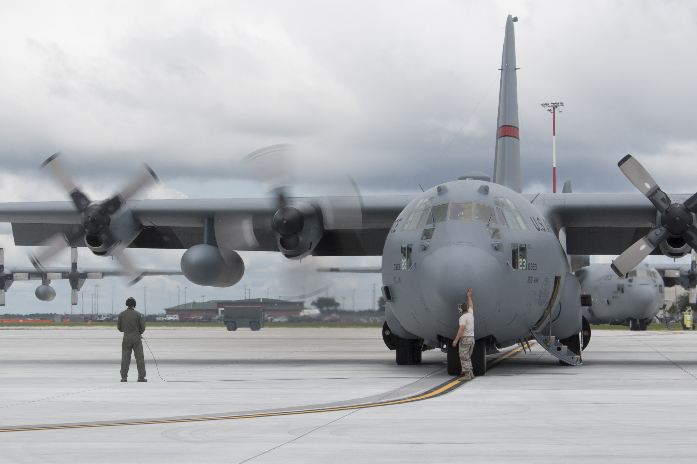  Airmen from the Georgia Air National Guard prepare the last C-130H2 Hercules used by the Savannah-based 165th Airlift Wing to fly into retirement one morning in June 2016. &nbsp;(Dash Coleman/Savannah Morning News)&nbsp; 
