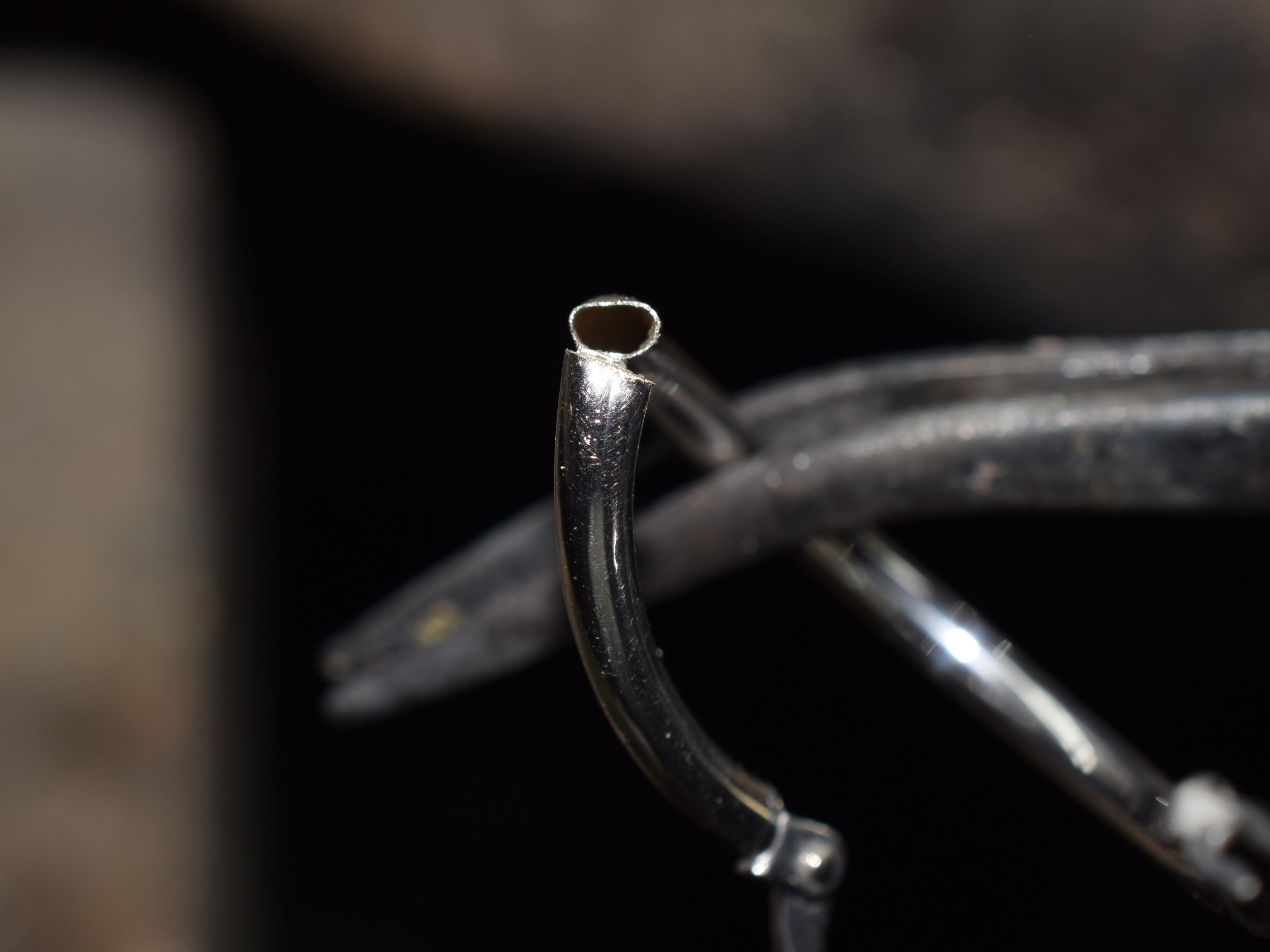 Hoop earring made from .08mm thin tubing.