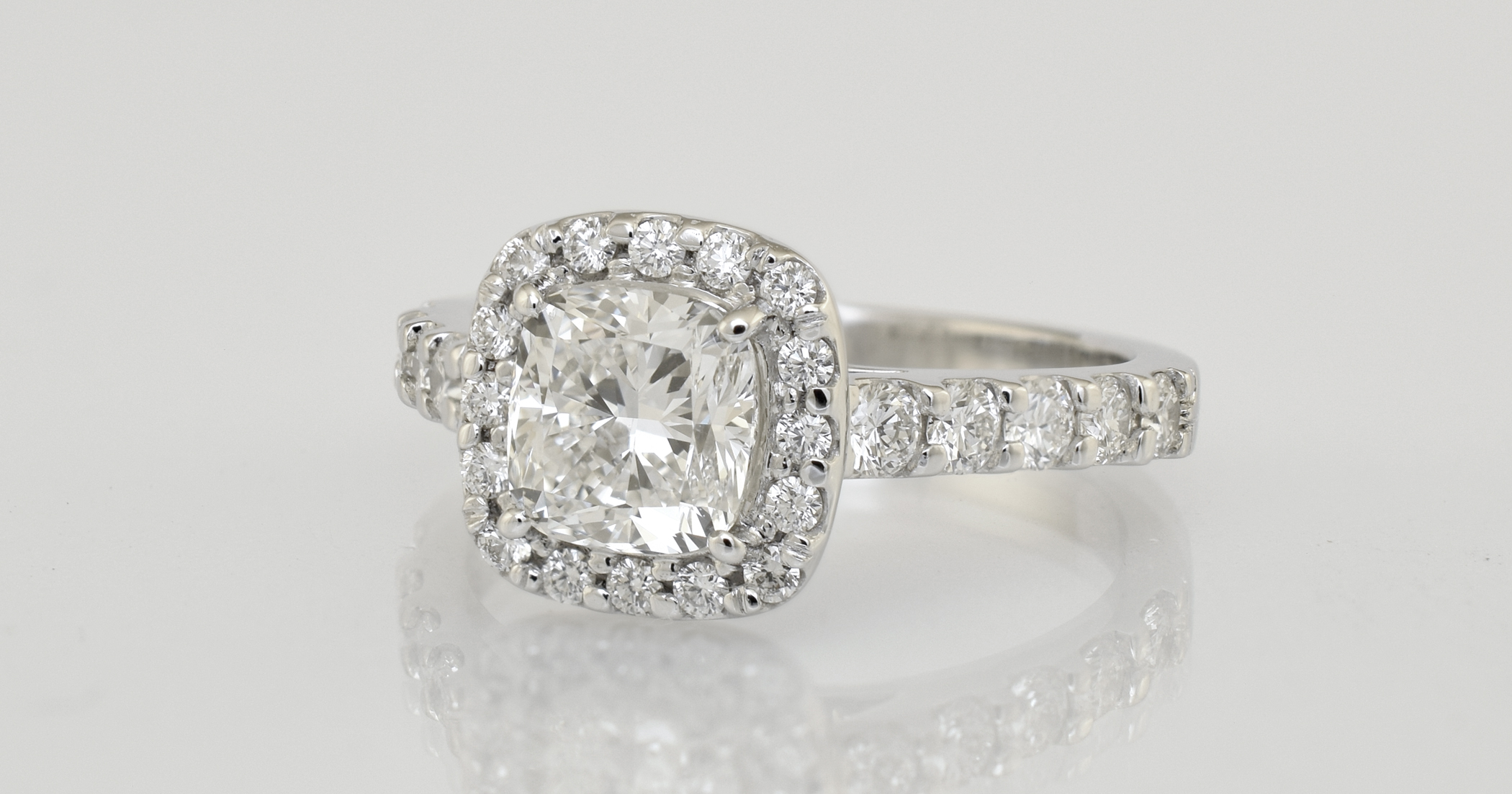  2 -&nbsp;&nbsp;.90 carat main diamond, cushion cut. Total diamond weight 1.30 carats 