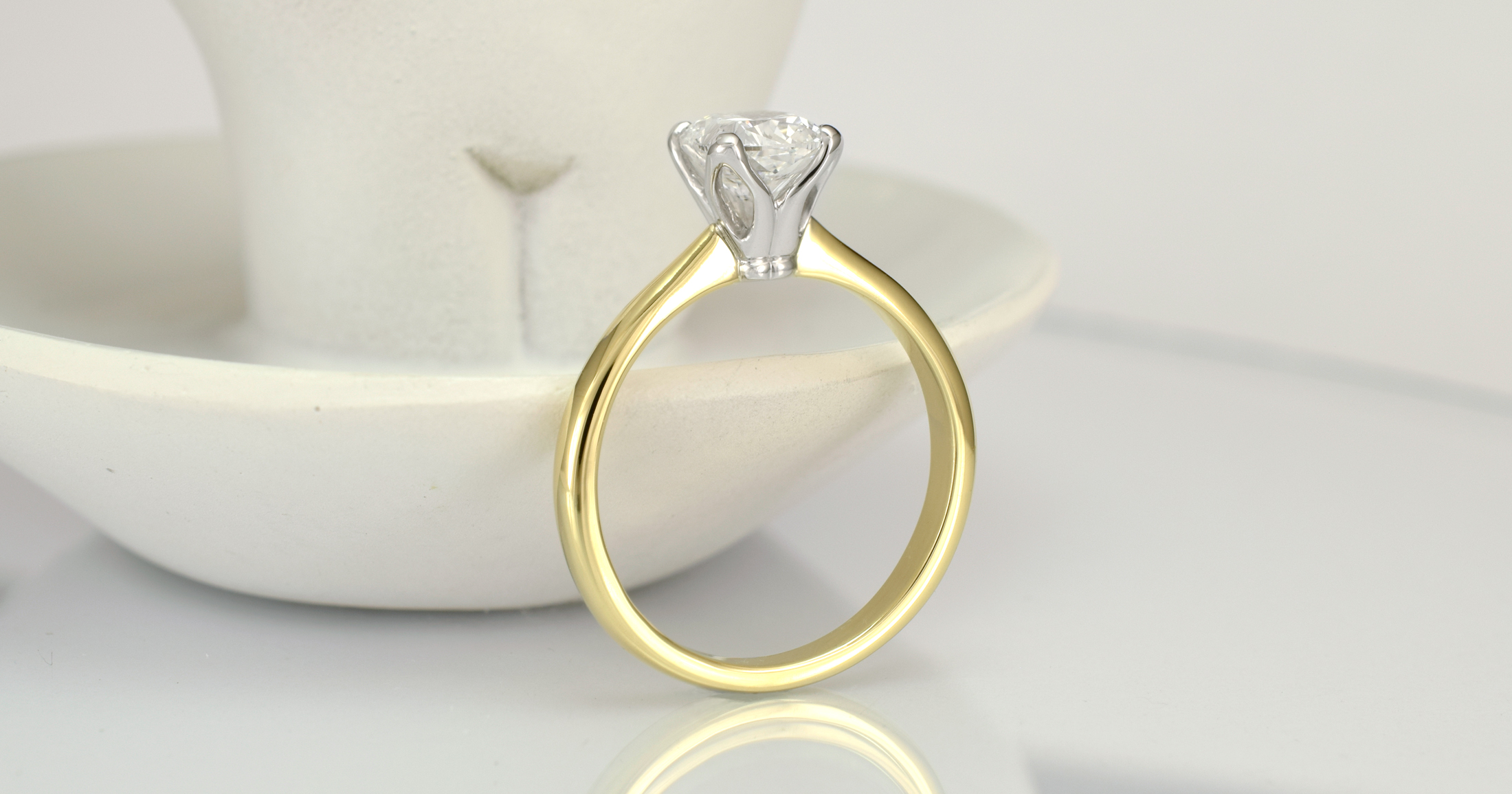  1 carat cushion cut in a temporary ring. 