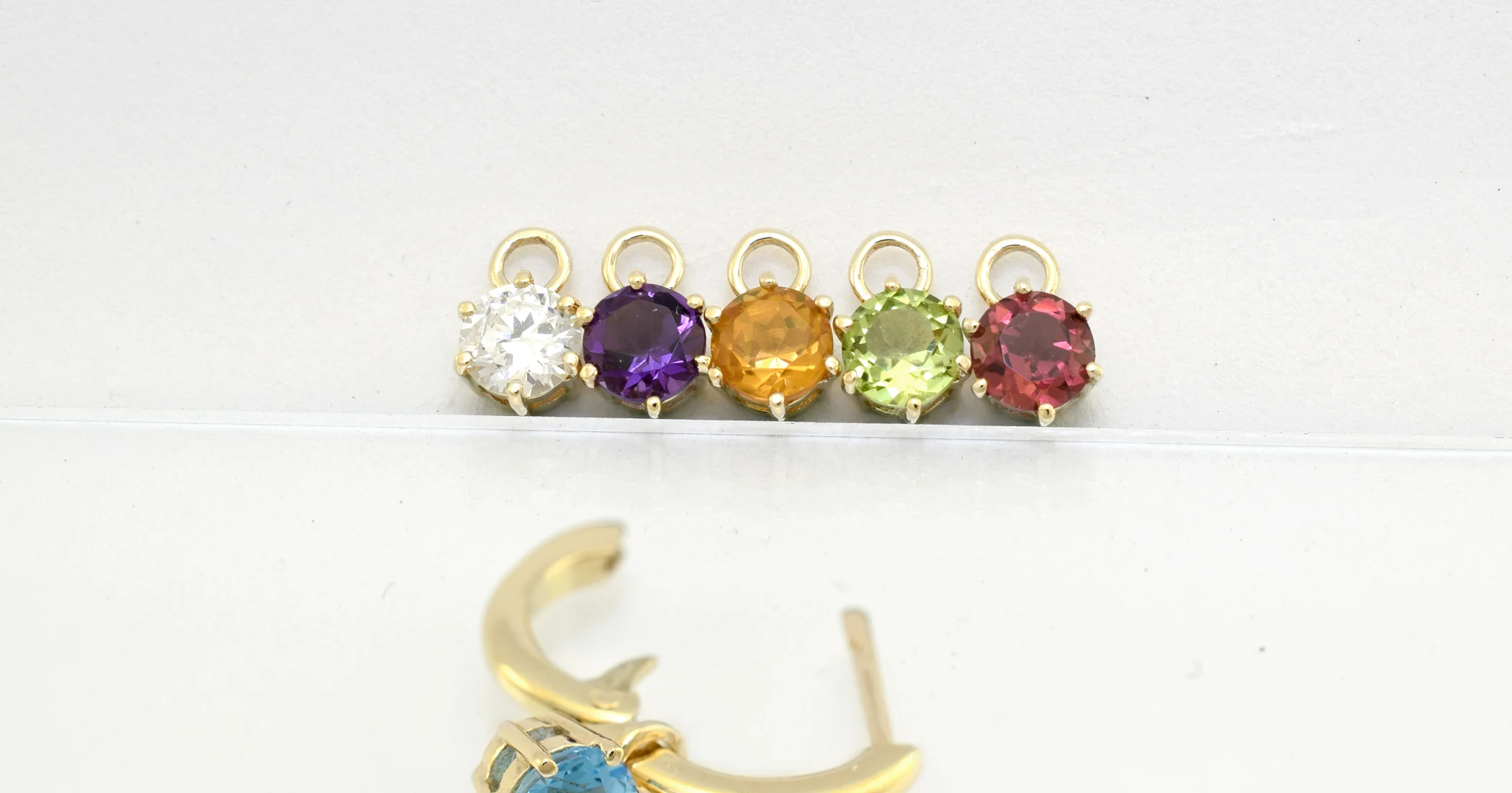 $85 Pod pair only (no hoop) in 9ct yellow gold set with any of the gemstones displayed.