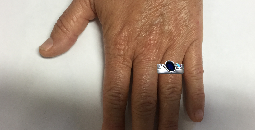 Mockup of the two rings to scale on her hand.