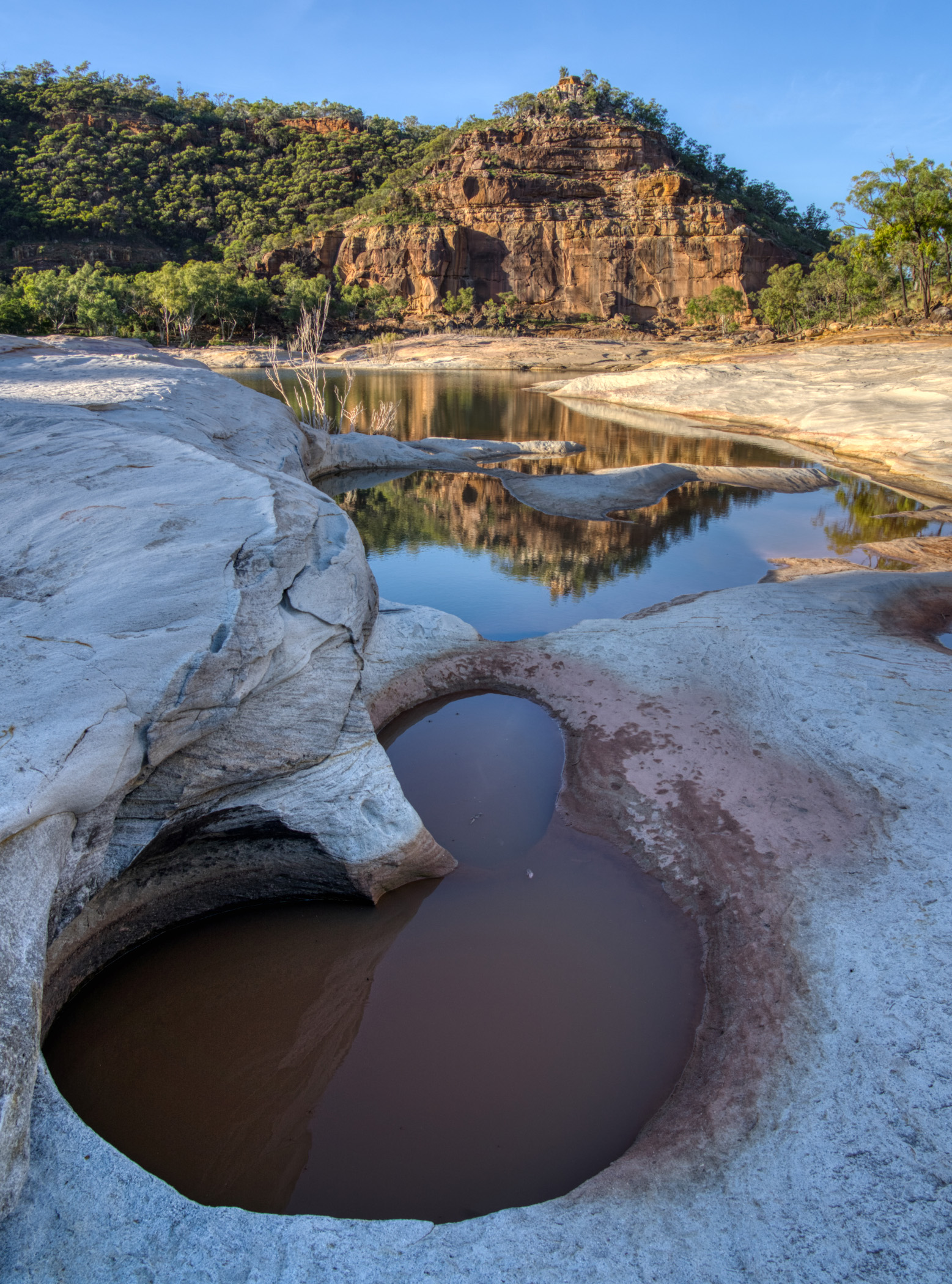 Rock formations above the river filled with water from the rain.