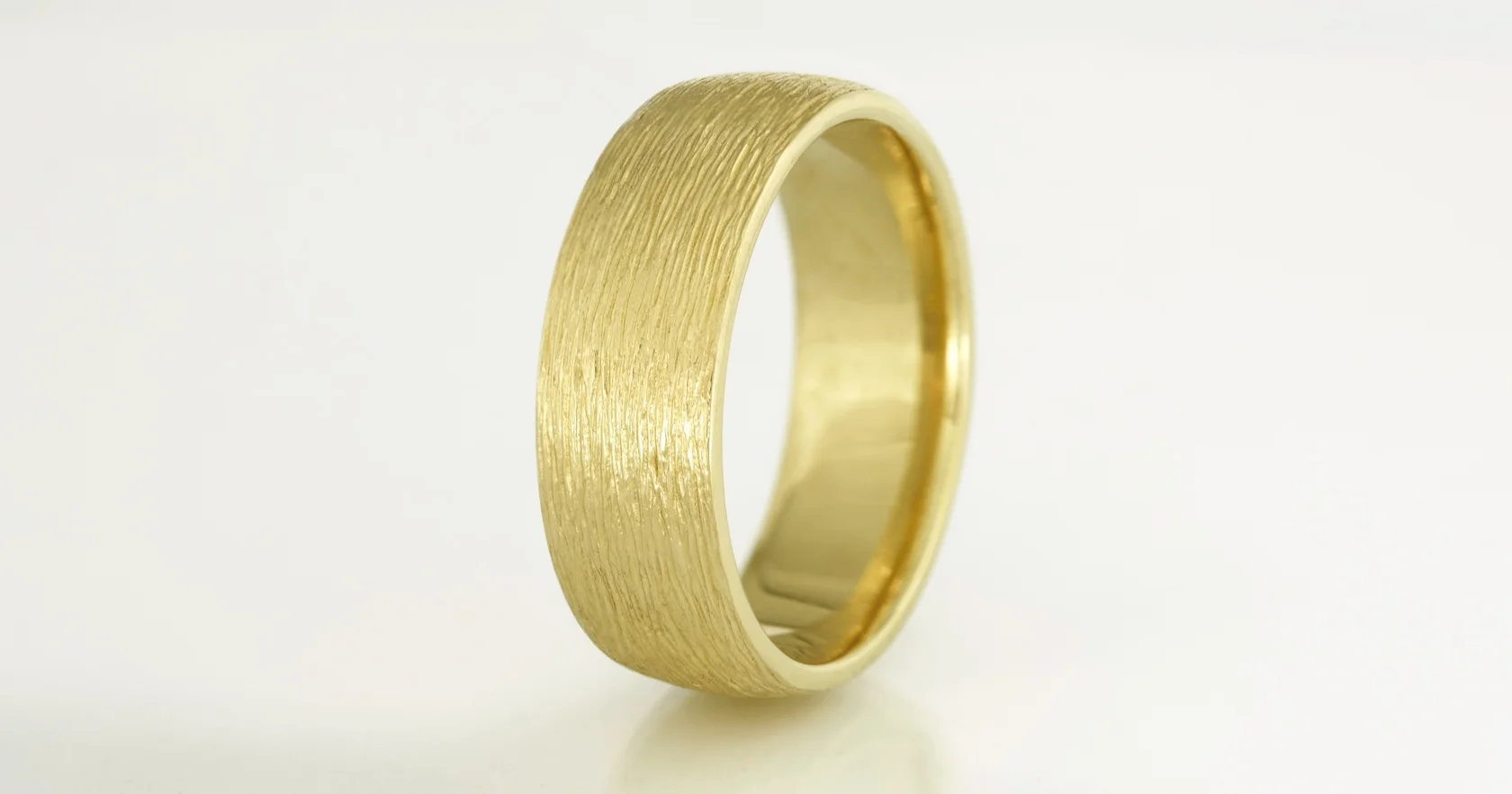 The finished ring in 18ct yellow gold at 7.5mm wide.