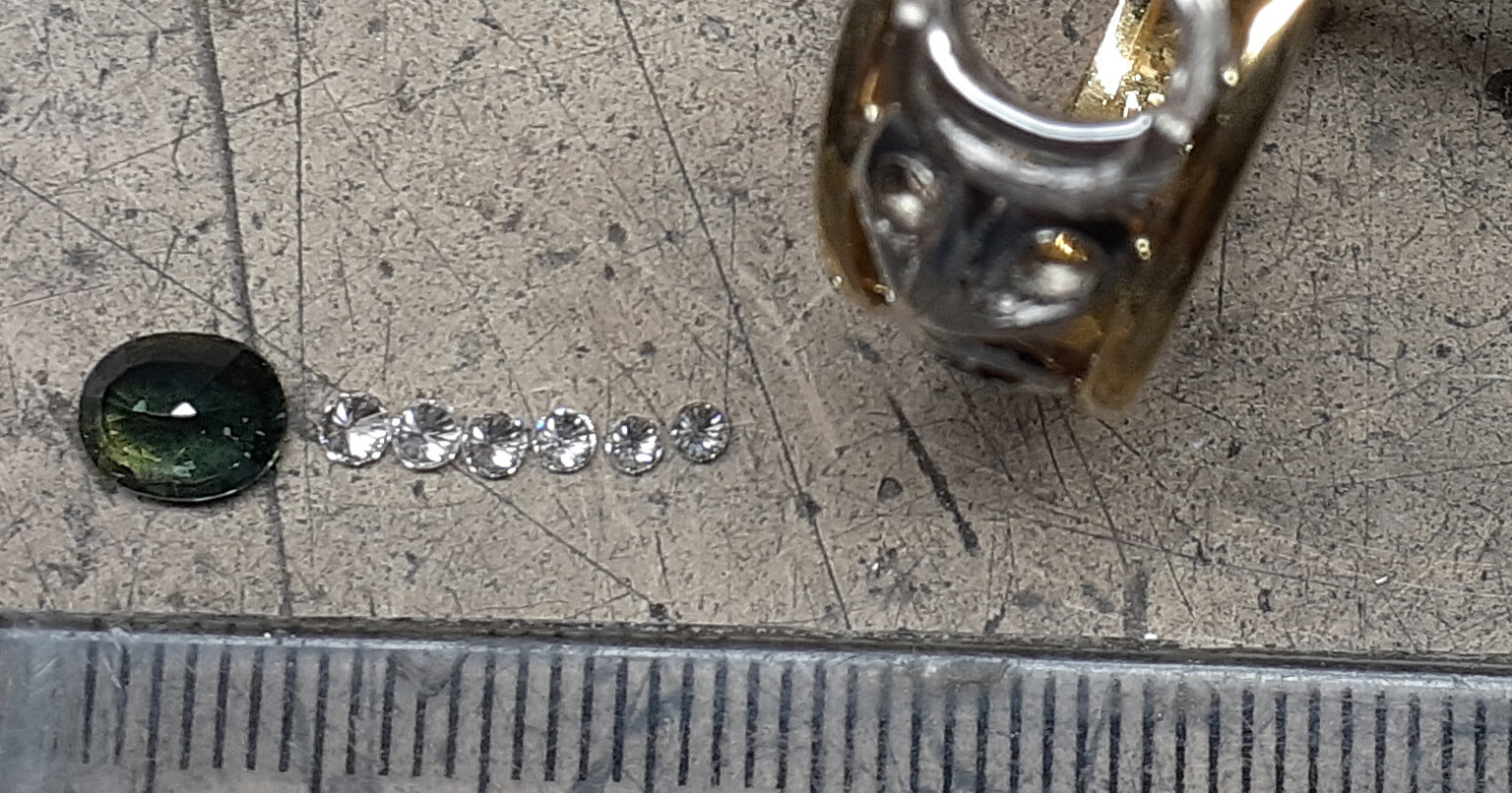 The sapphire and diamonds from this ring would all be used in the new ring.