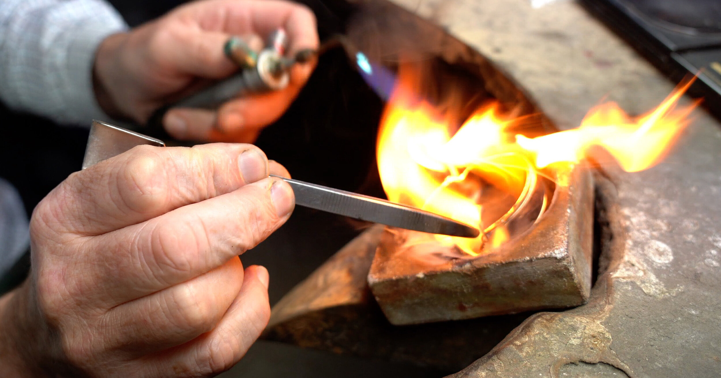  The material added to the inside of the bangle igniting during the melt. 