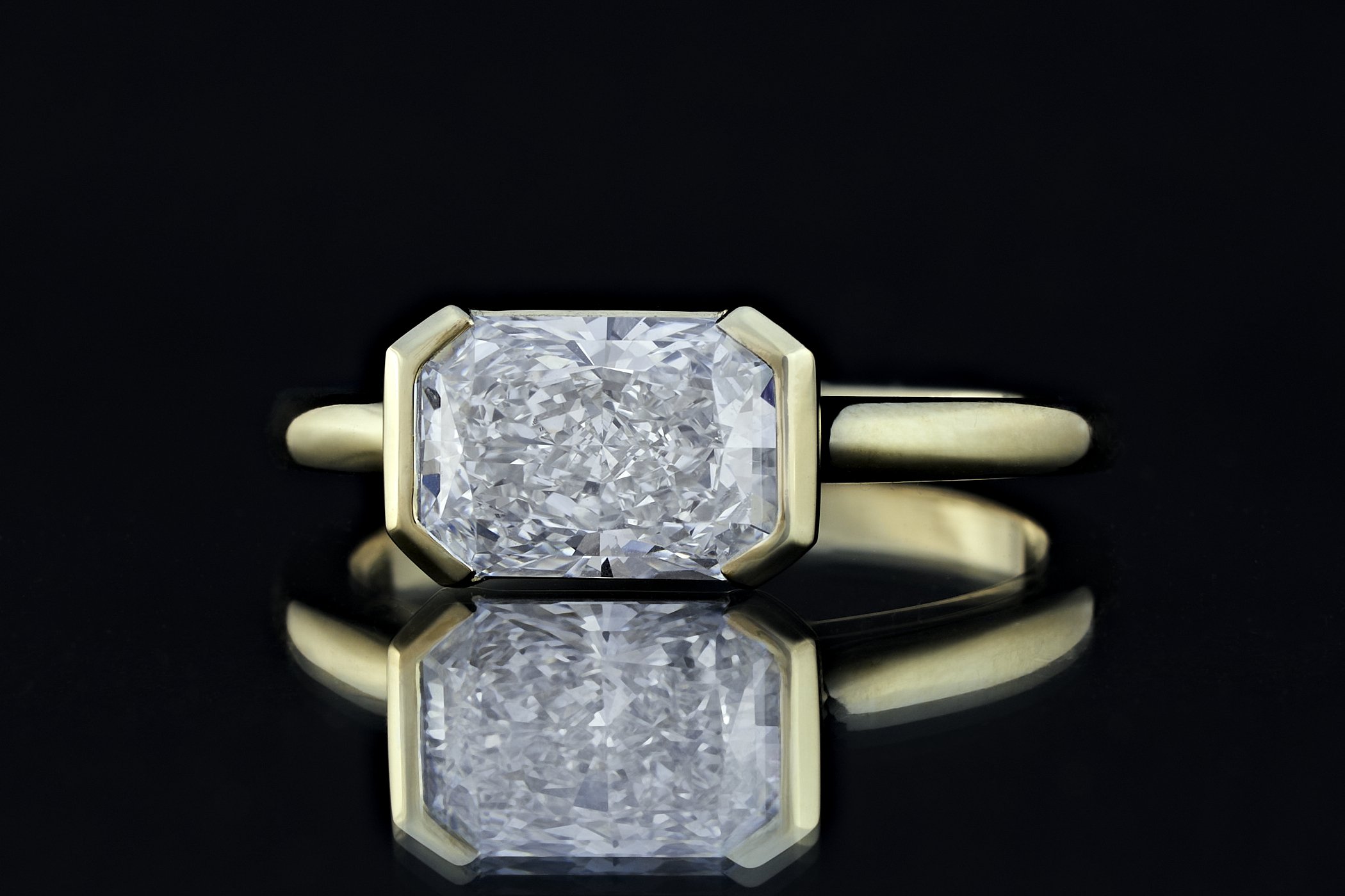 Across the finger Radiant cut solitaire