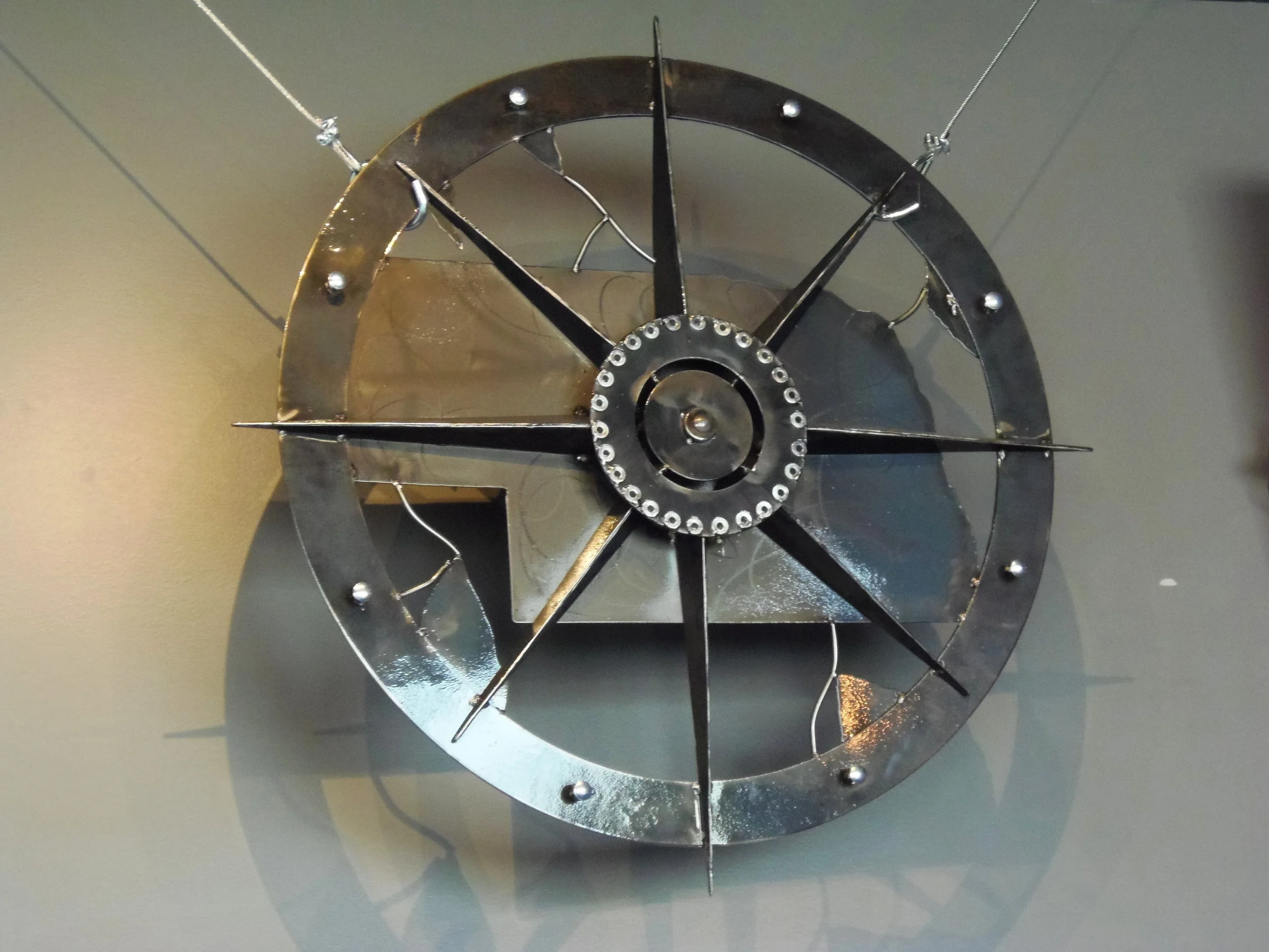 Beautiful metal art piece of the Lost Way Brewery logo in the taproom