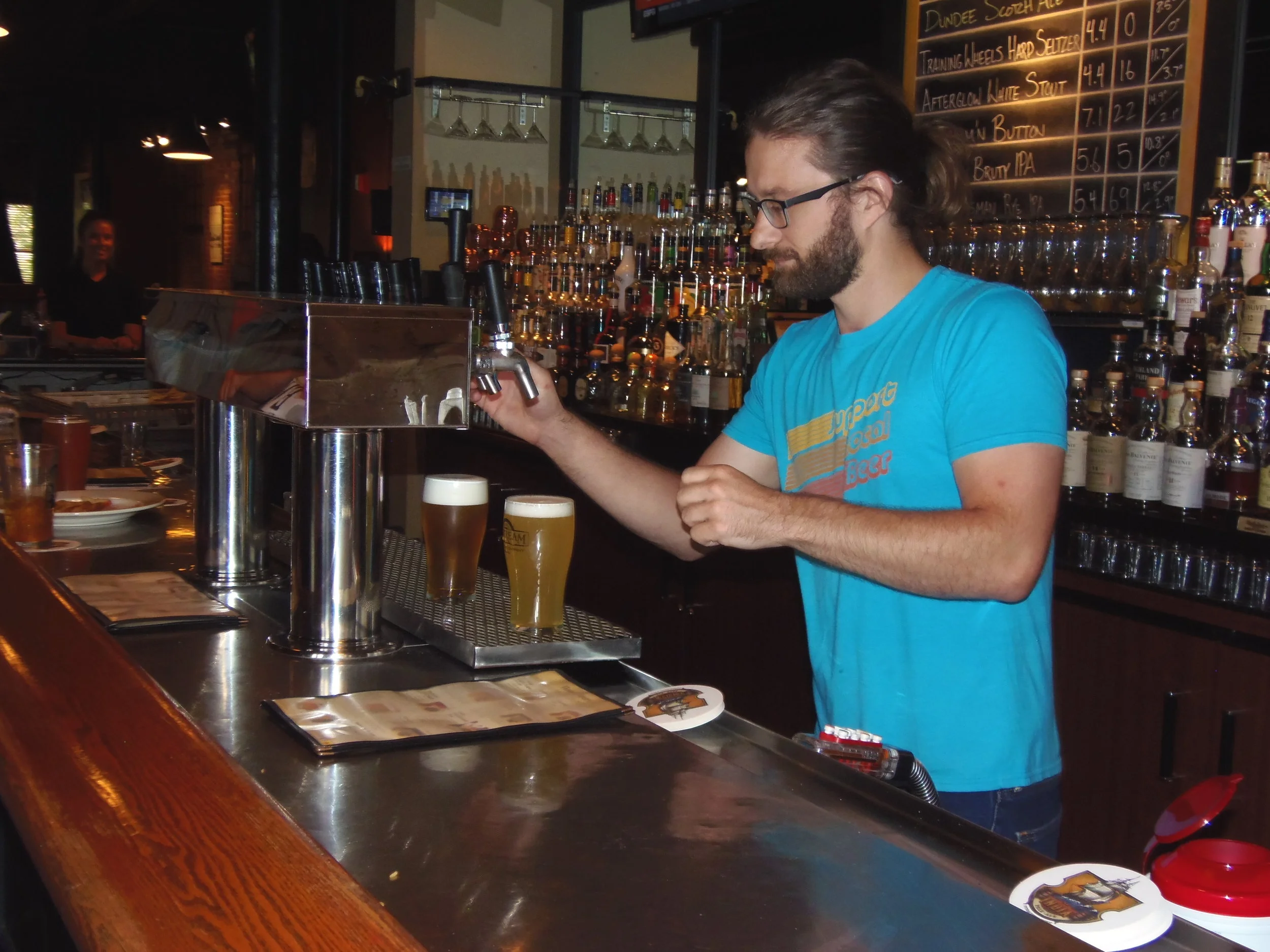 Dallas Archer, Head Brewmaster pouring a couple of Upstream finest beers!