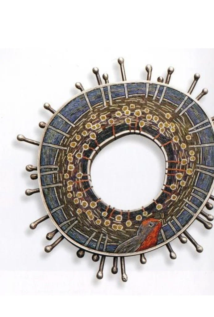 Decorative circular metallic object with Christmas-themed illustrations, including a Christmas tree, presents, and winter scenery, designed to resemble a clock face without hands.