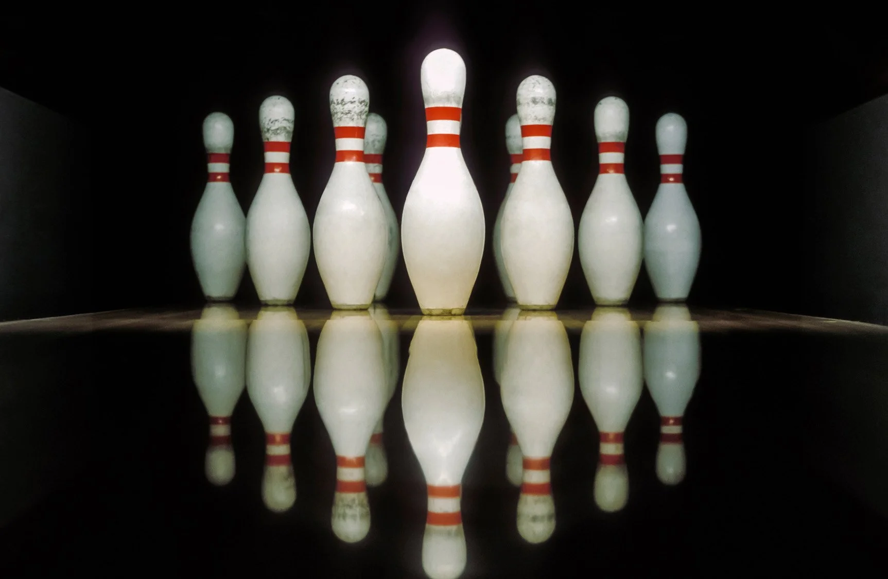 Bowling ball hitting pins representing the mental game of bowling