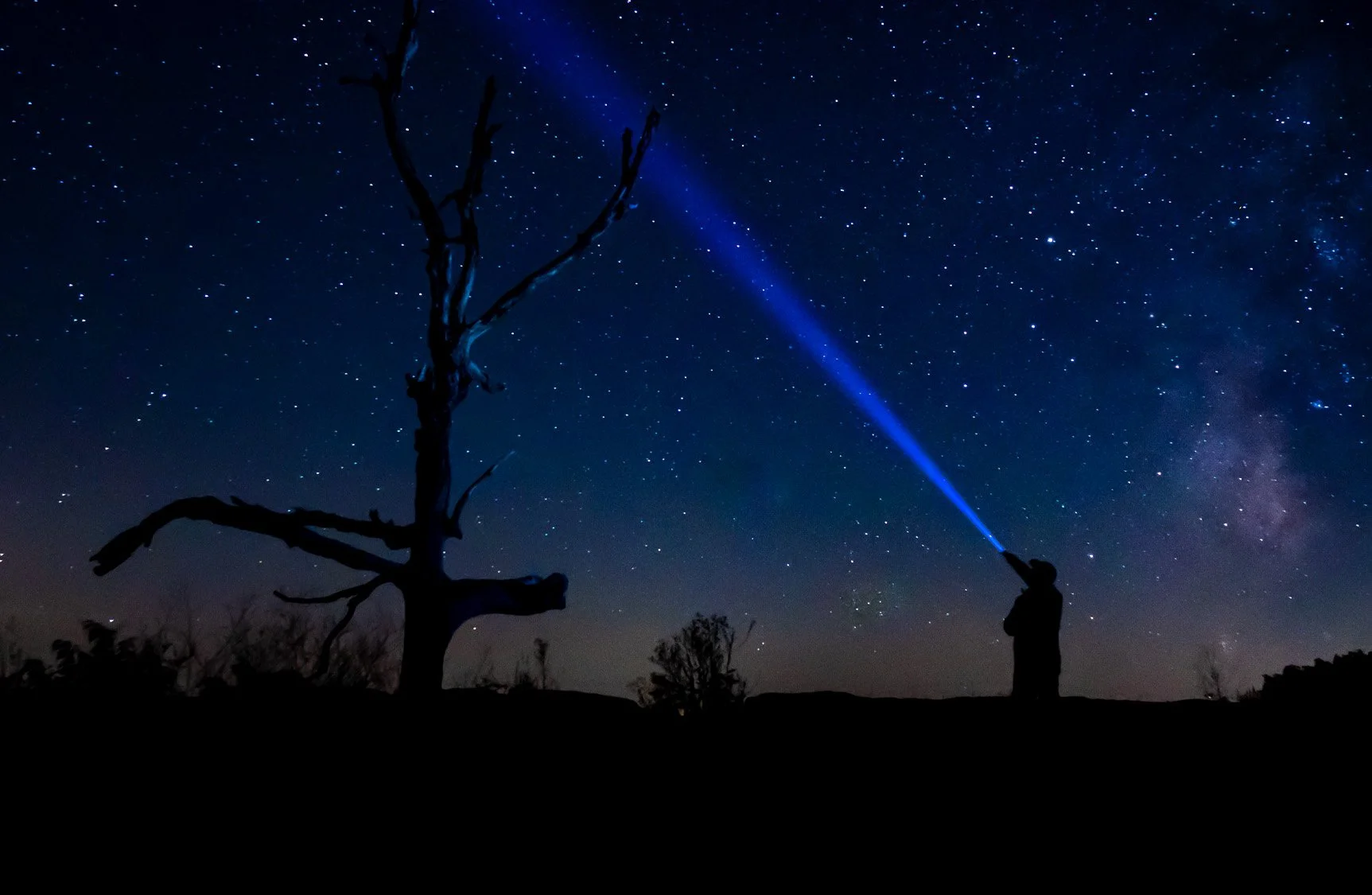 Night sky photography in Shenandoah National Park with stars and light beam