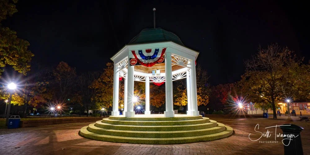Gazebo in downtown Front Royal Virginia decorated with American flags at night