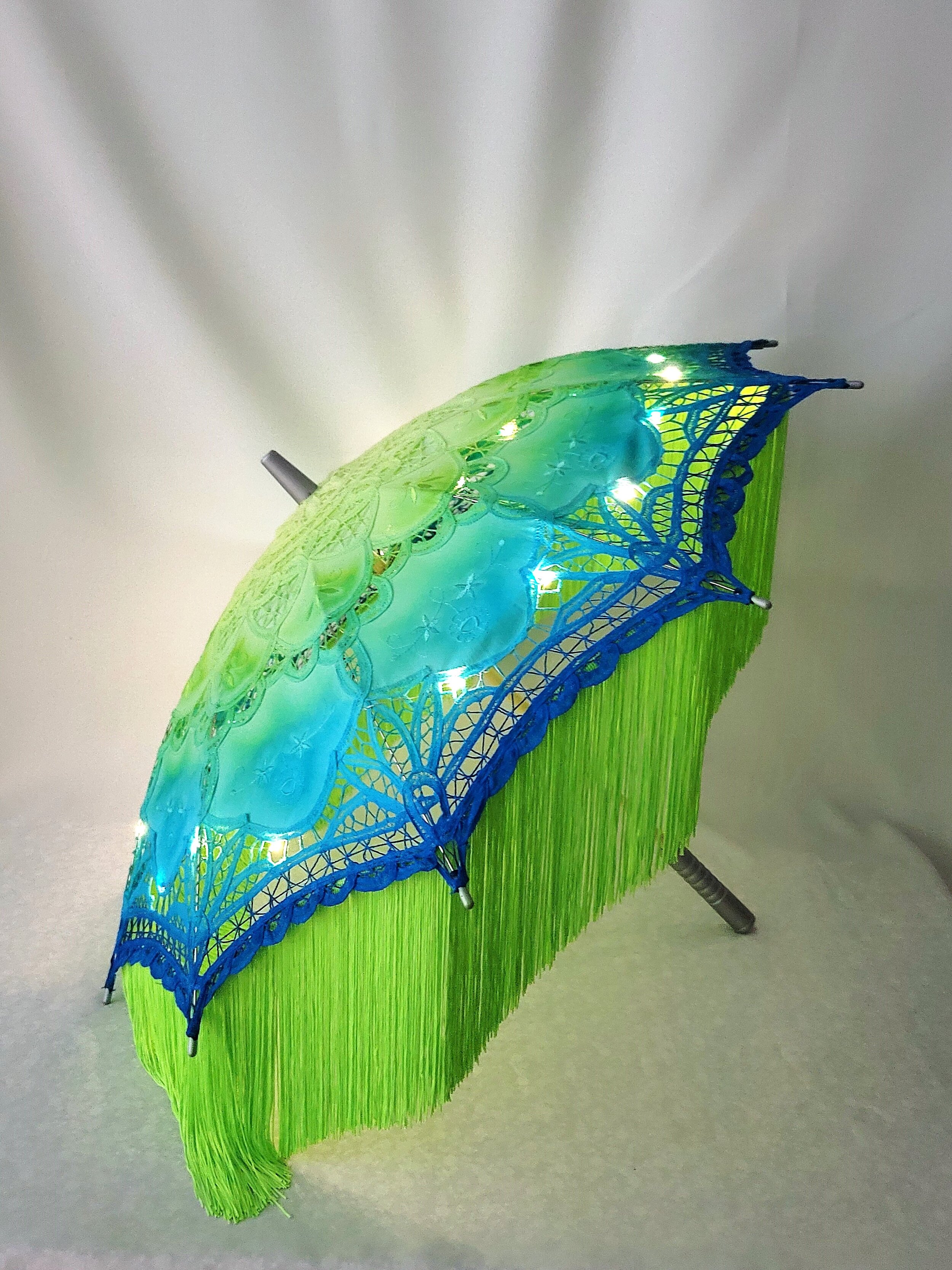 neon fringe parasol side lit tall.jpg