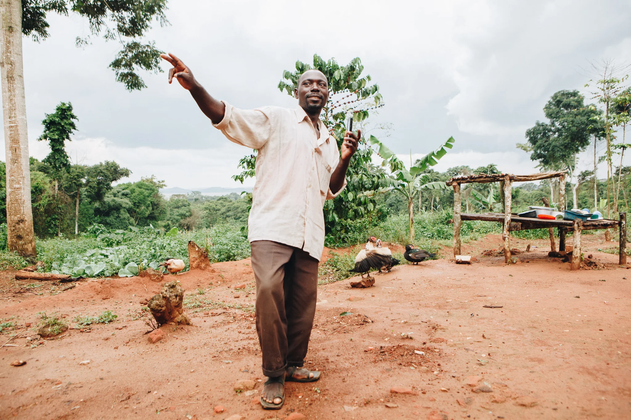 ©TomWoollard_Yunus-Social-Business_Uganda-editorial-portrait-african-man-dancing-on-pineapple-plantation-farm.jpg