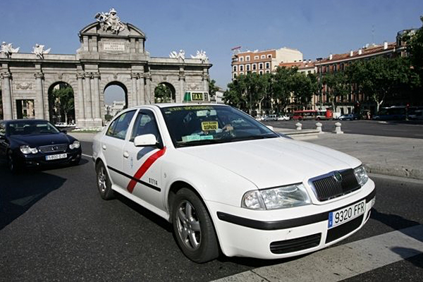 TAXI Good option during the night time when the metro doesn’t run. Flat fare from or to the airport is €30. Official Madrid Spain transport taxis are white with a red stripe.