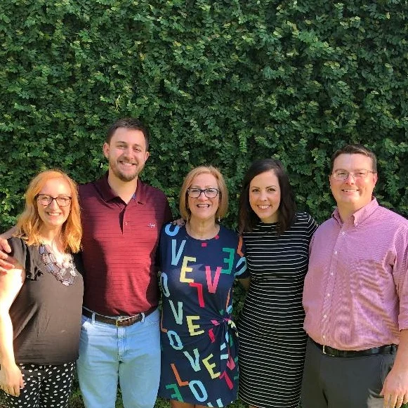 A picture at the vine wall in the back of the church on Mother’s Day 2019 with Delisa and children, Chaillie and Kenrick on her right and Kenrick’s wife, Lizzi, and Chaillie’s husband, Andrew on her left.