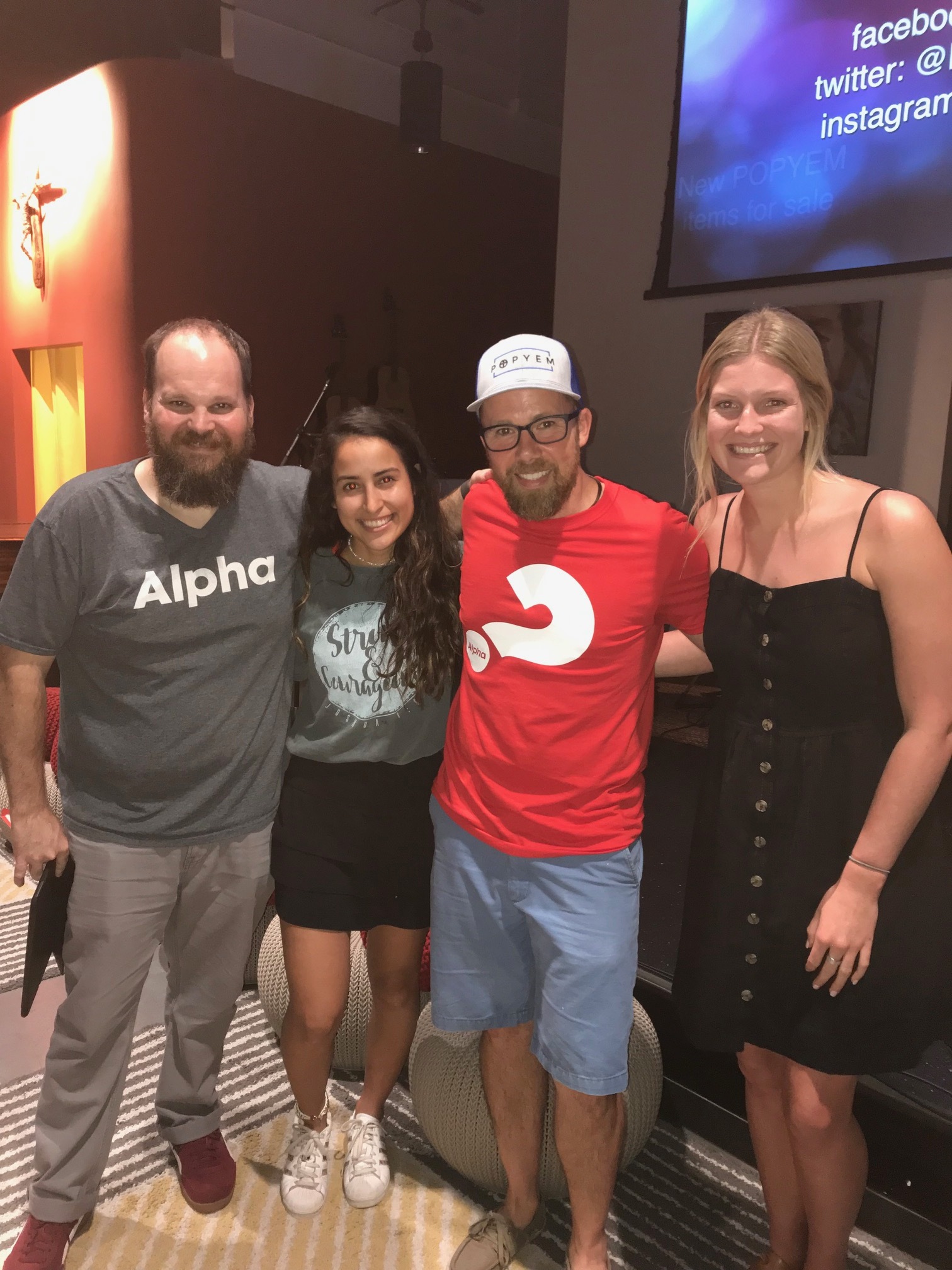 Ailyn Carbajal (middle left) is joined by POPYEM staff, (left to right) Dave Regitz and Matt Regitz, and summer intern, Katie Stewart, at a Sync youth night.