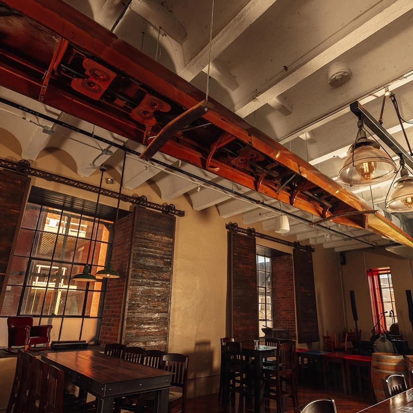 Hanging above our taproom is a piece of Olympic history.

This 60-foot Pocock racing shell is the sister boat to the legendary Husky Clipper, made famous by The Boys in the Boat. Built alongside the Husky Clipper, it was used by the University of Was