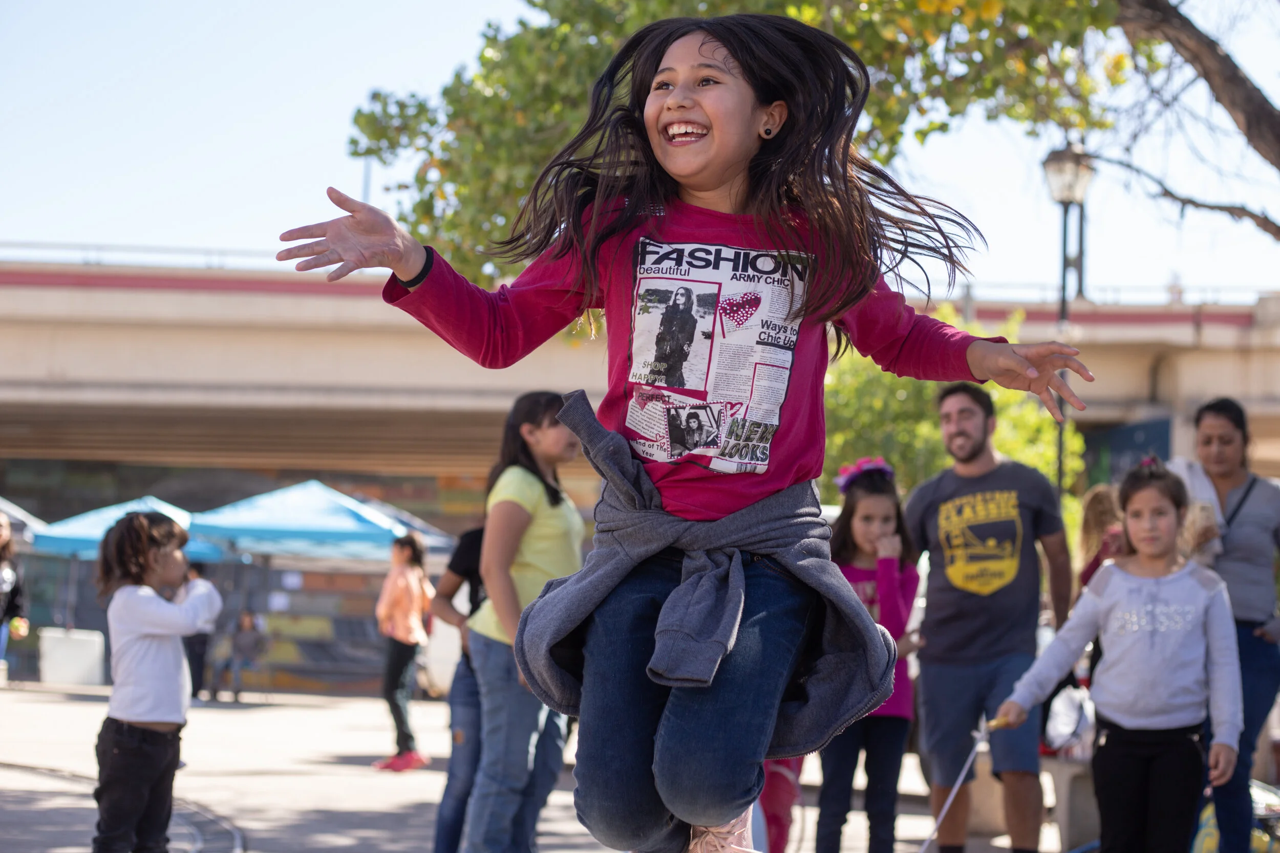  A girl practices jumping rope during an activities fair for kids in Nogales, Mexico, just south of the U.S.-Mexico border. (For the Border Youth Tennis Exchange) 