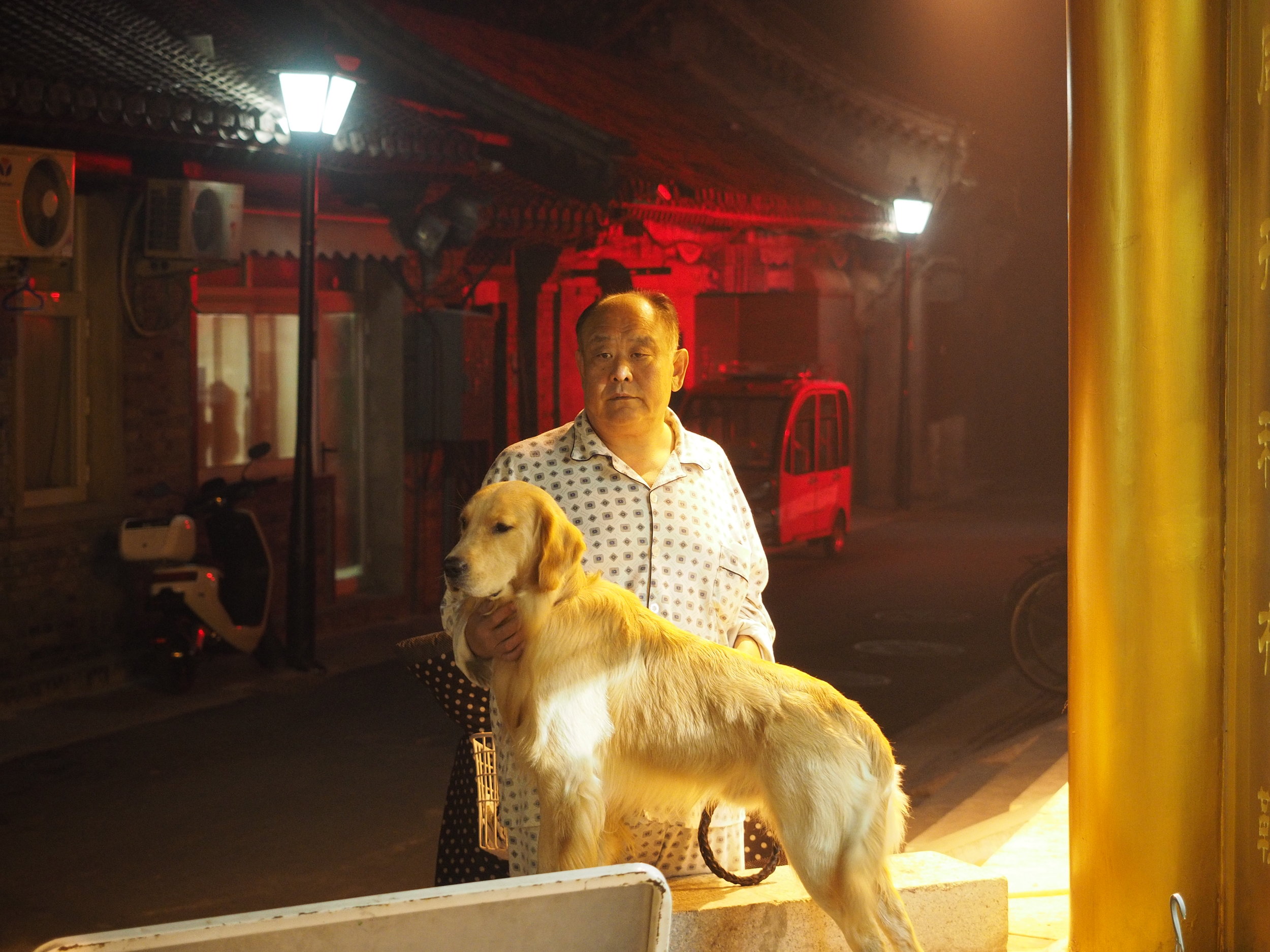 Just a man walking his dog in his pyjamas.