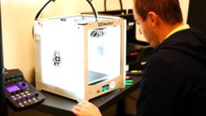 Fab@CIC Grand Opening attendee 3D prints on an Ultimaker.