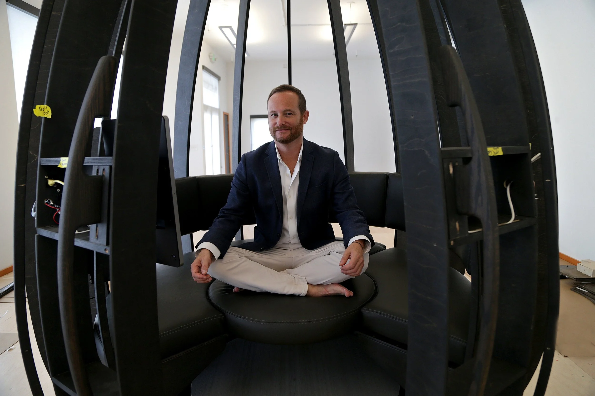 Jonathan Marcoschamer inside a prototype of OpenSeed’s meditation pod at CIC Miami.