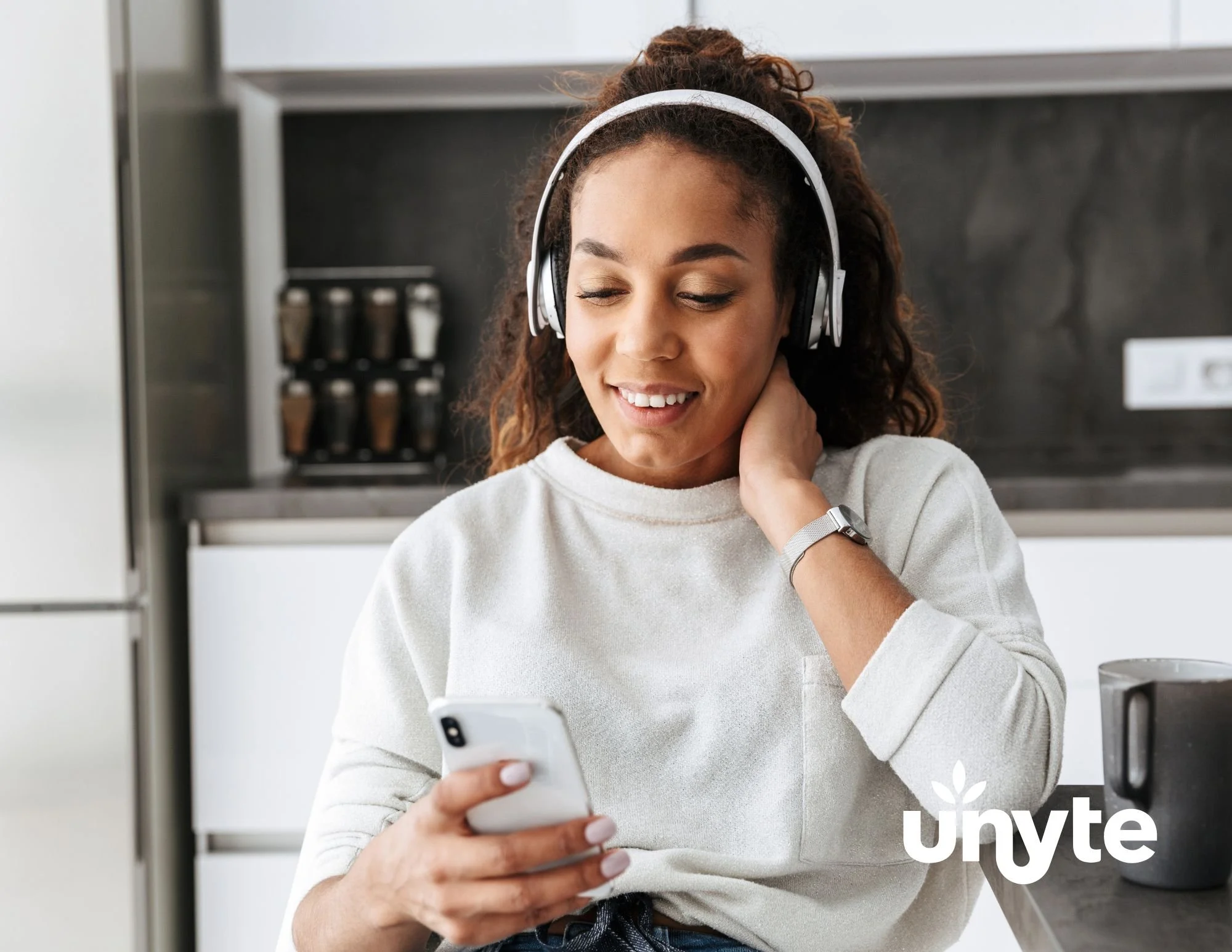 Woman listening to music on headphones.
