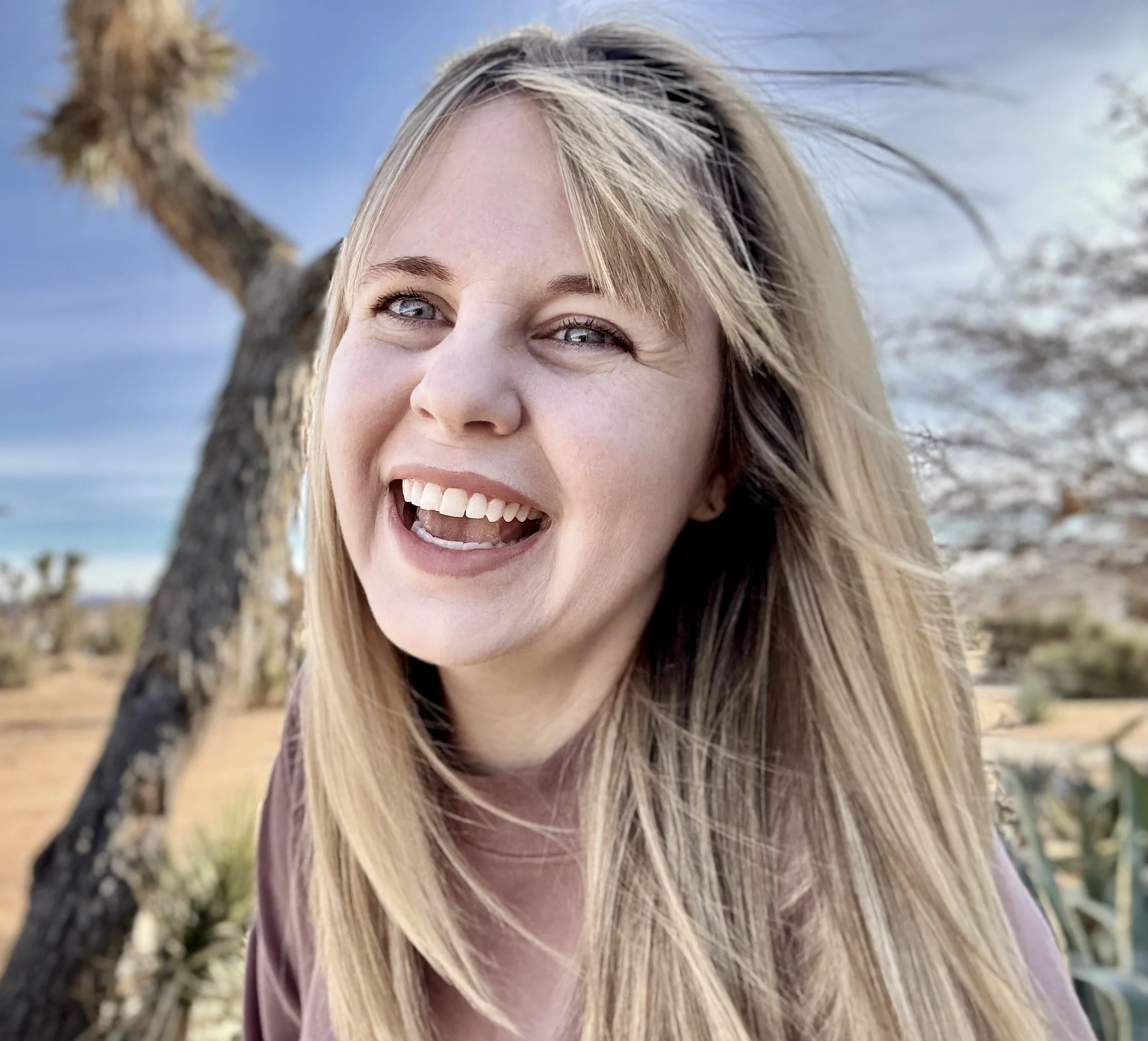Picture of Blair Lord with Joshua Tree in background.