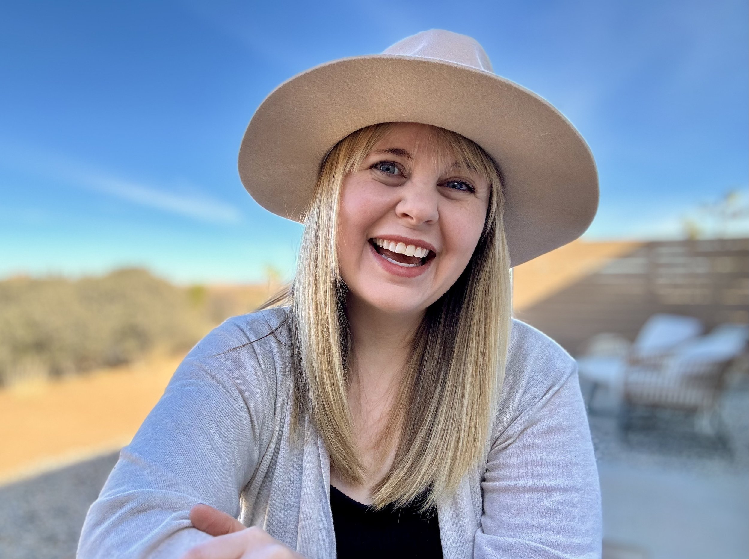 Picture of Blair Lord wearing hat, blue sky in background.