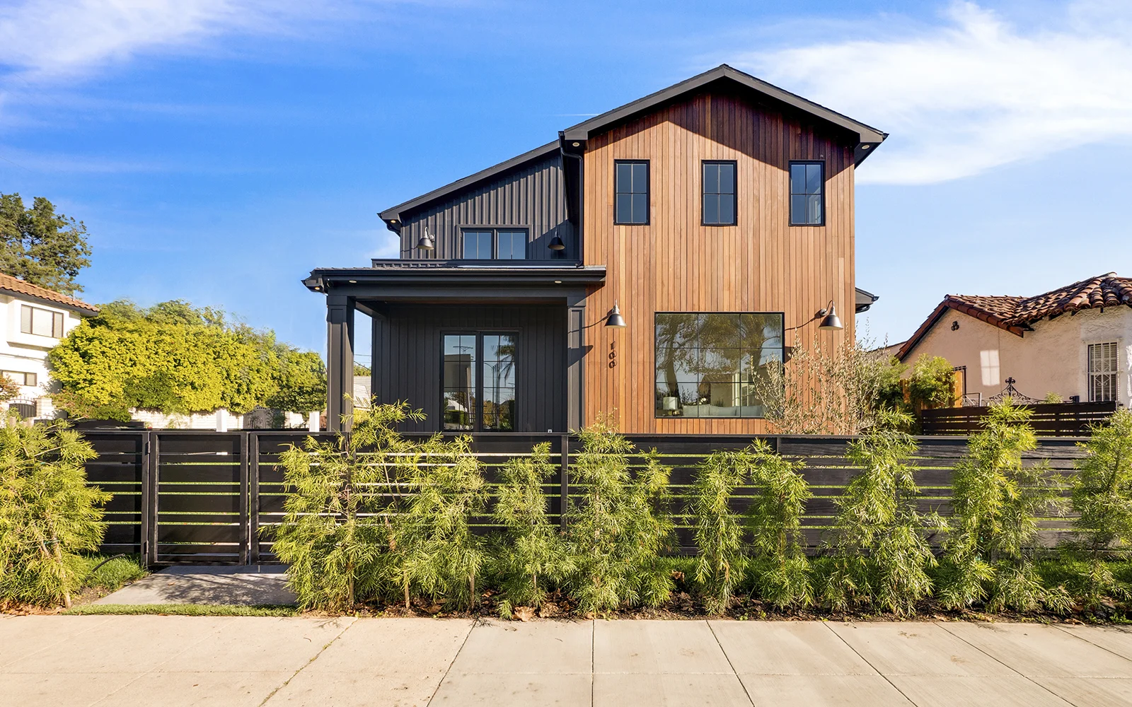 CRESCENT HEIGHTS | MIRACLE MILE Craving respite from the city? Welcome to this newly built modern farmhouse retreat, just a stone’s throw from the pulse of Hollywood. Blurring the boundary between indoors and outdoors, the five-bed, six bath, smart home lets the landscape and natural light flow through.