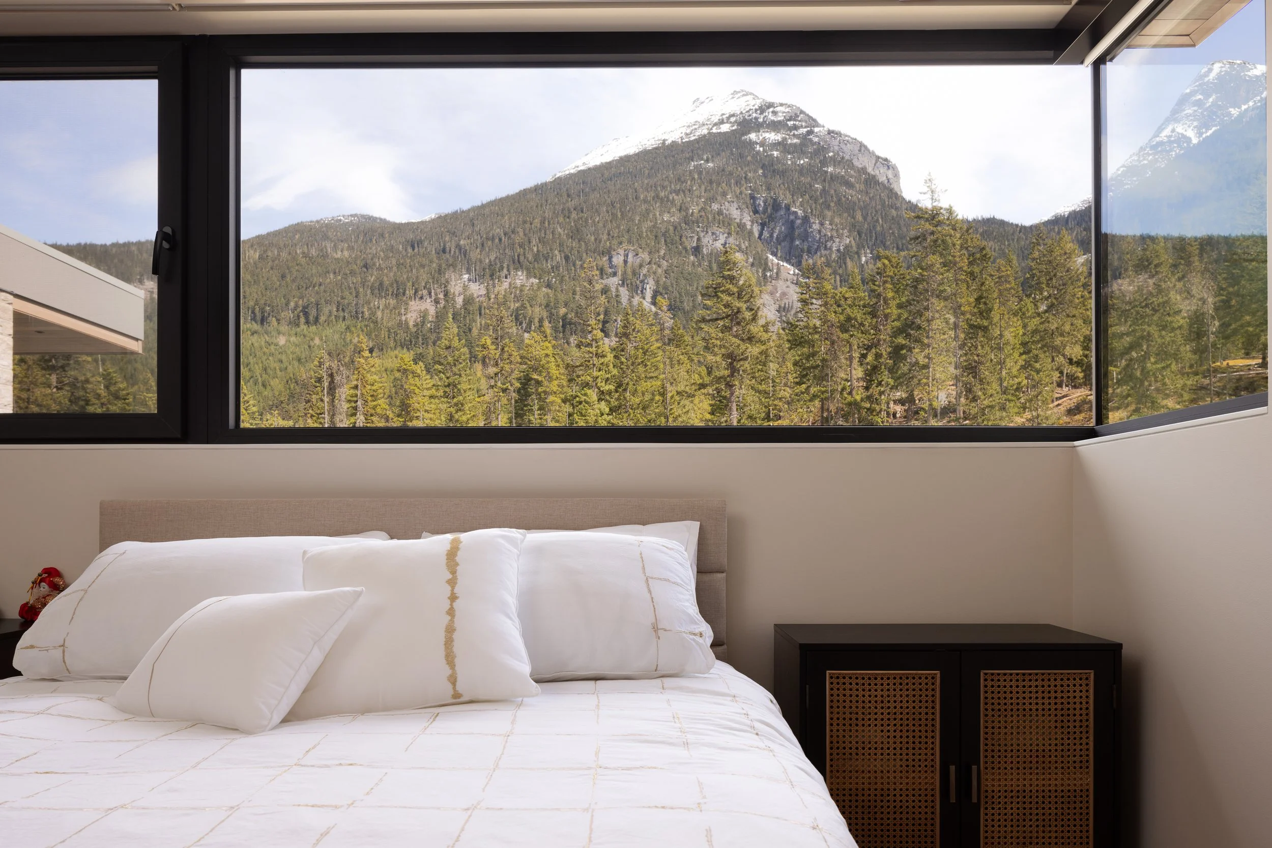 Custom, corner windows maximize mountain views in this home.