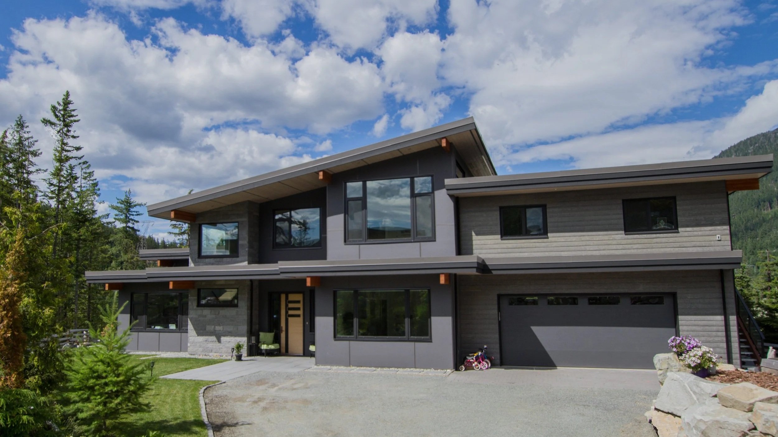 Custom home in Wedgewood Whistler with modern exterior and large windows.