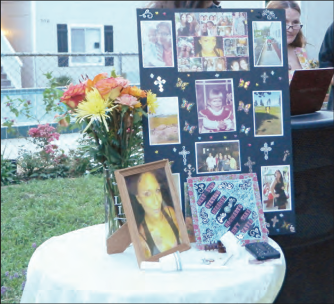Photos of Brandy Johnson were displayed at a memorial service held for her at Lyn Gardens Apartments on June 21. Beacon photo/Anthony DeFeo