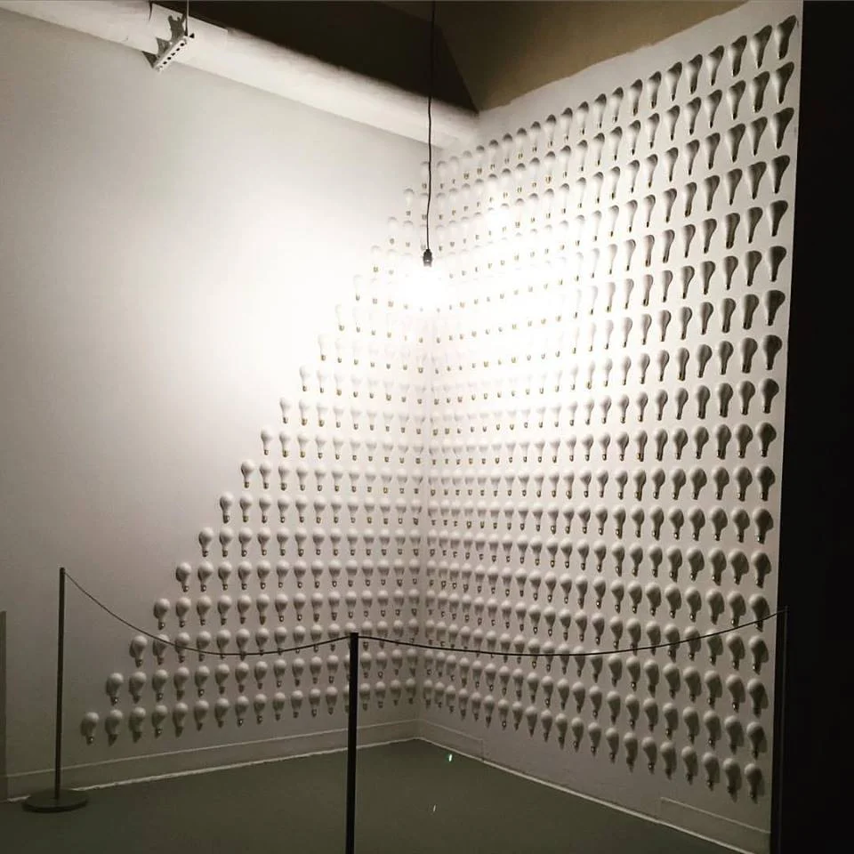 Installation shot including light and mixed media elements.