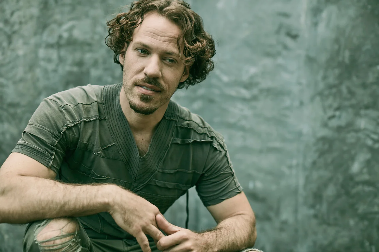      

 
   Falk Hentschel is not who he appears to be on screen. Whether you’ve known him as ‘Hawkman’ from the CW’s “DC Universe” or are eagerly anticipating his role as brutal neo-Nazi Hauptsturmführer Ludwig Topf in the upcoming film, “Welcome to