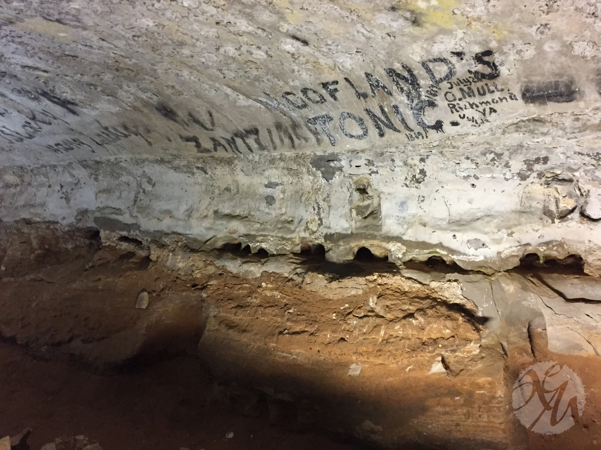Civil War-era graffiti on the walls of the Snowball Room, which was used as a dining hall for tours in decades past. Much of the graffiti was created using the soot from candles and lamps, but the "Cofland's Tonic" you see in this photo used some kind of paint. It was a kind of snake oil.
