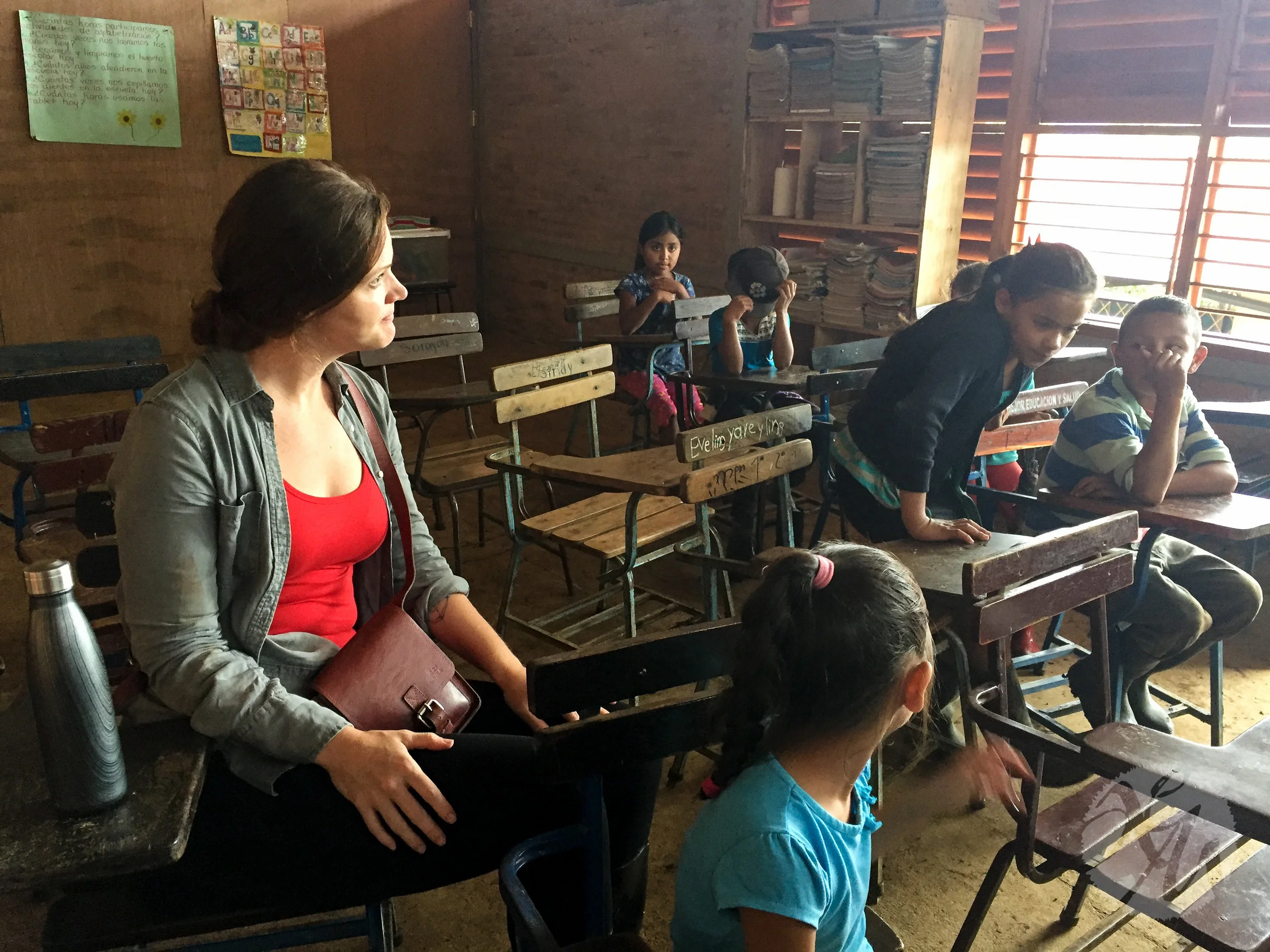 Project Alianza founder Kristin Van Busum sits among students at one of Alianza's first rural schools in Nicaragua.