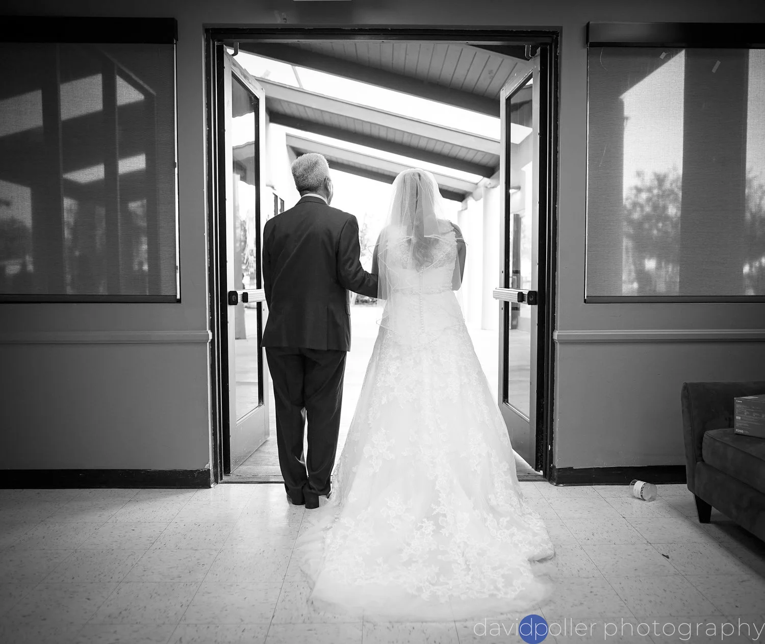 Miriam is escorted by her father at her wedding ceremony