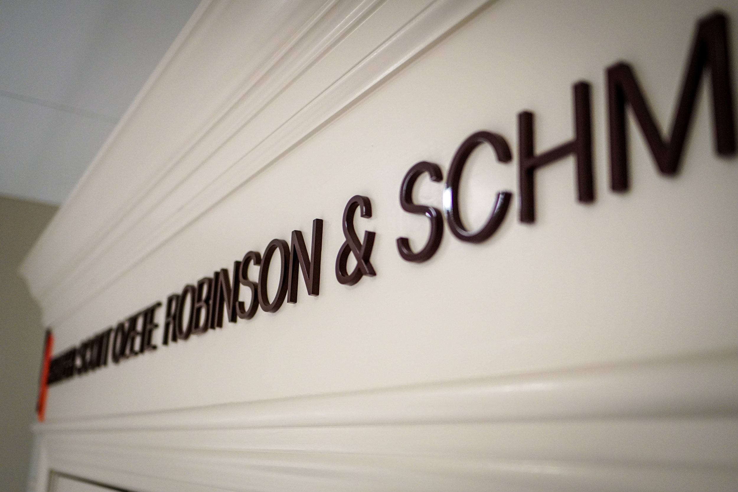 Farmer Scott Ozete Robinson and Schmitt banner above front door