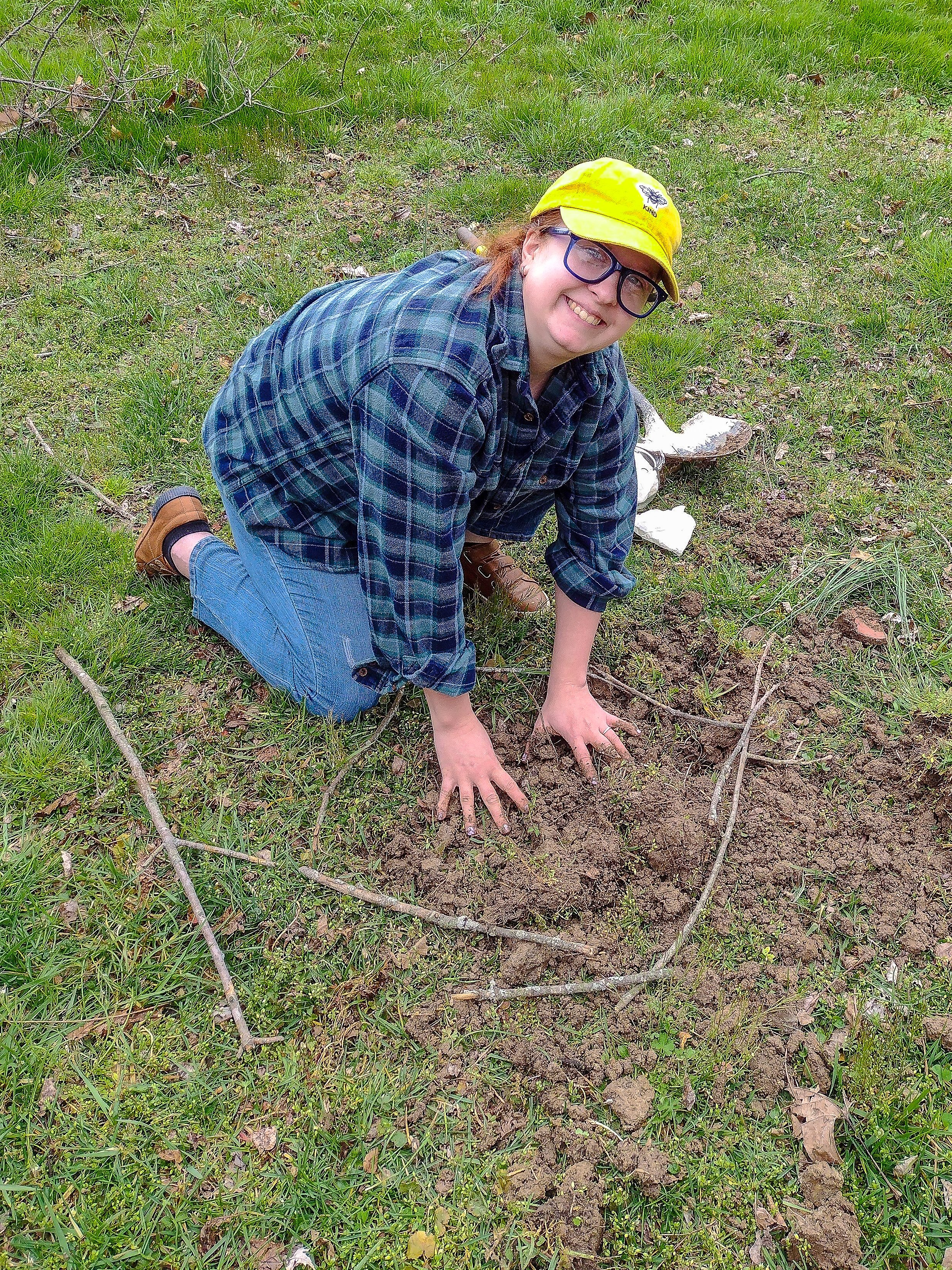 Receptionist Elyse Carter Planting A Tree.jpg