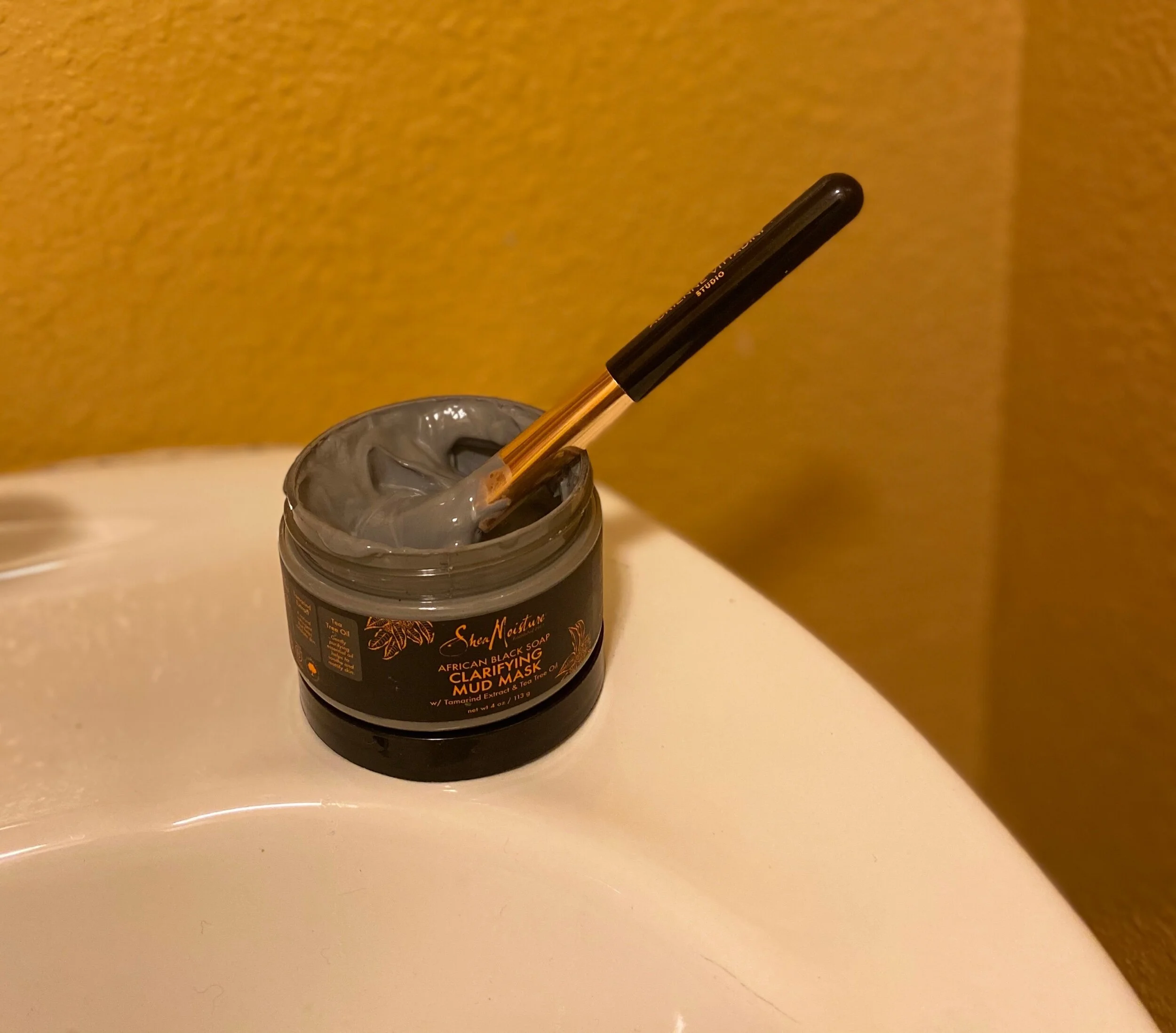 I use this brush to apply a thin even layer of the mask on my face.