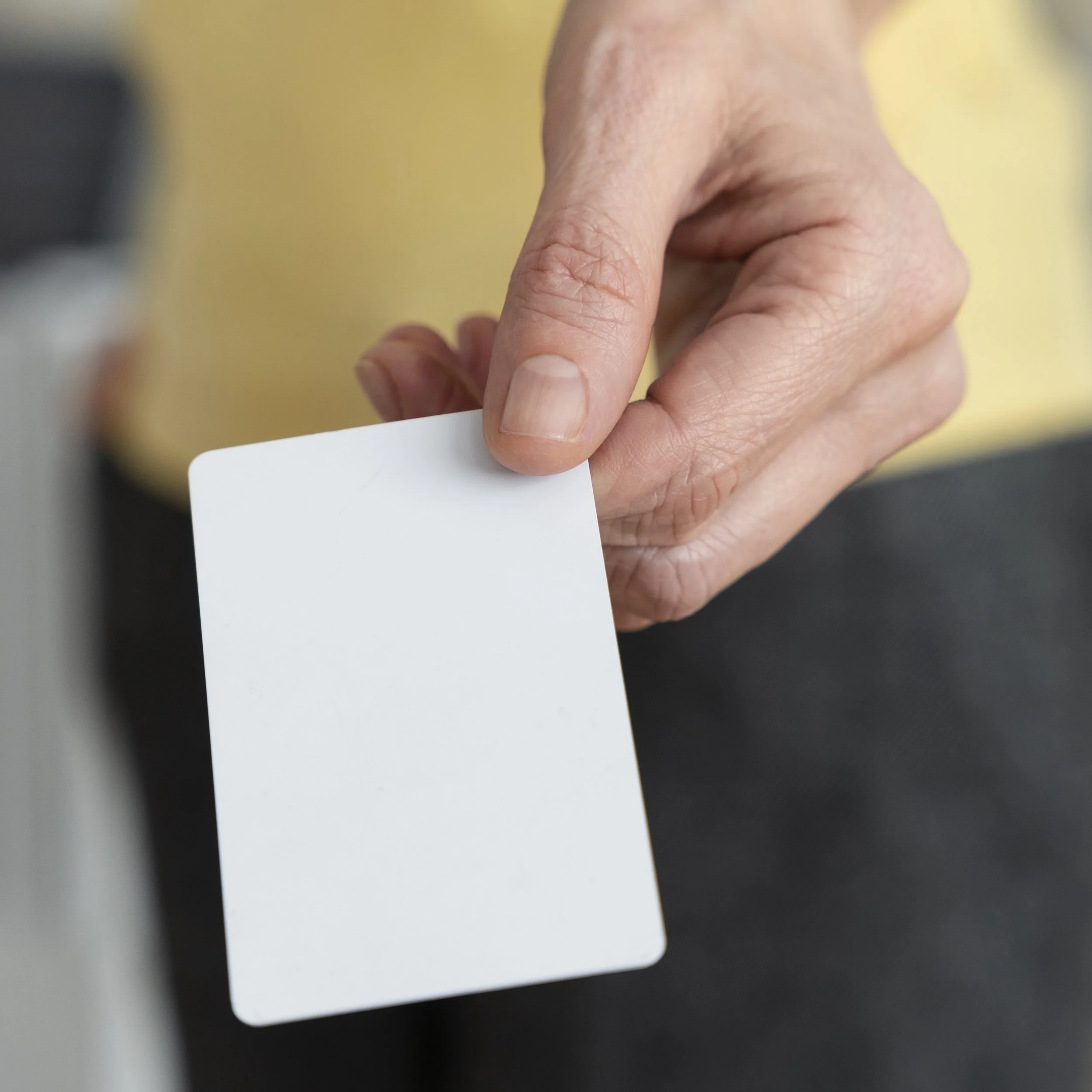 hand-holding-blank-business-card-high-angle.jpg