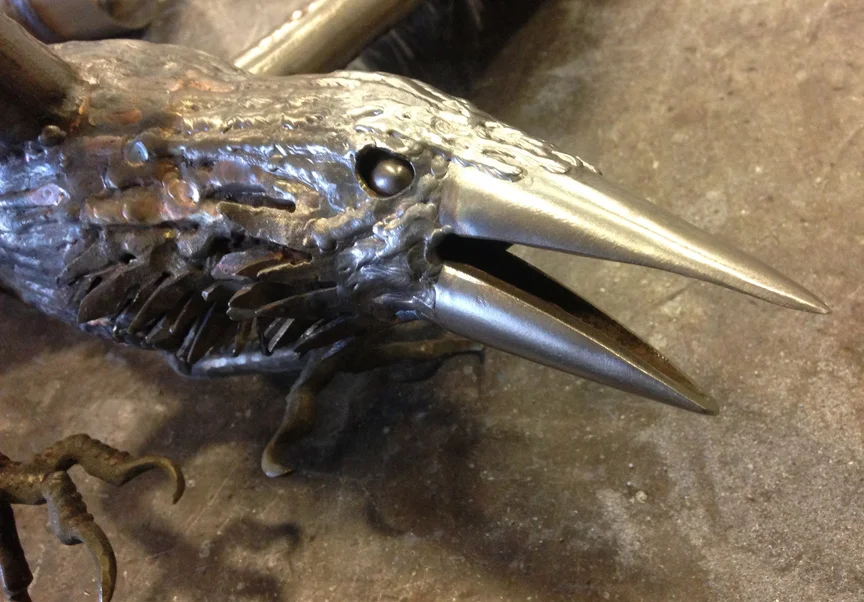  Stainless steel crow. I can't figure out what to do for a base, so he sits on my mantle silently mocking me. 